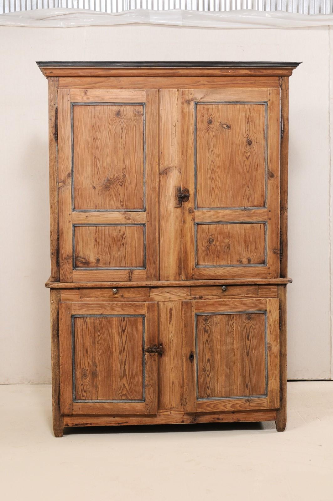 A French early 19th century tall enclosed storage cabinet. This antique French buffet à deux-corps (which is the name for a French buffet consisting of an upper and lower case, 