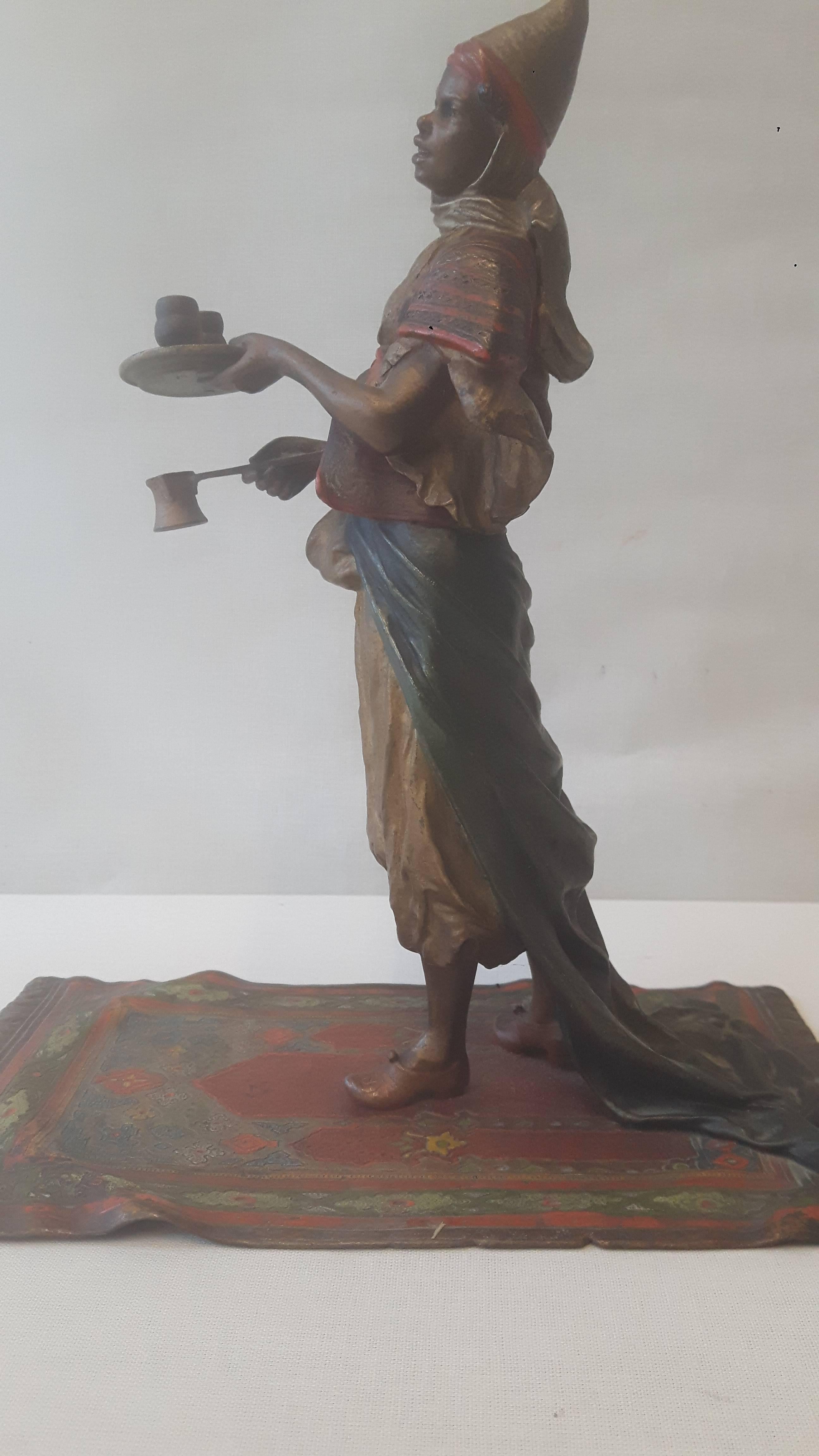 A cold painted bronze figure of an eastern lady serving coffee most probably Bergman work shop.