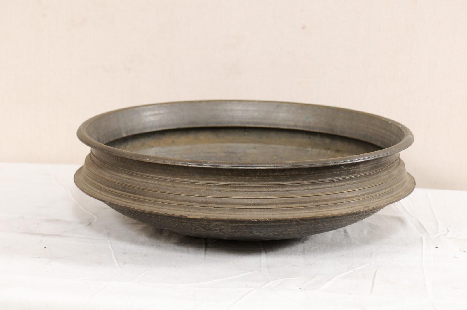 An Uruli vessel from Southern India. This uruli, from the early 20th century, is made of bell metal. Urulis are vessels which are circular in shape and shallow in depth, and were typically used in traditional cookware extensively used in southern