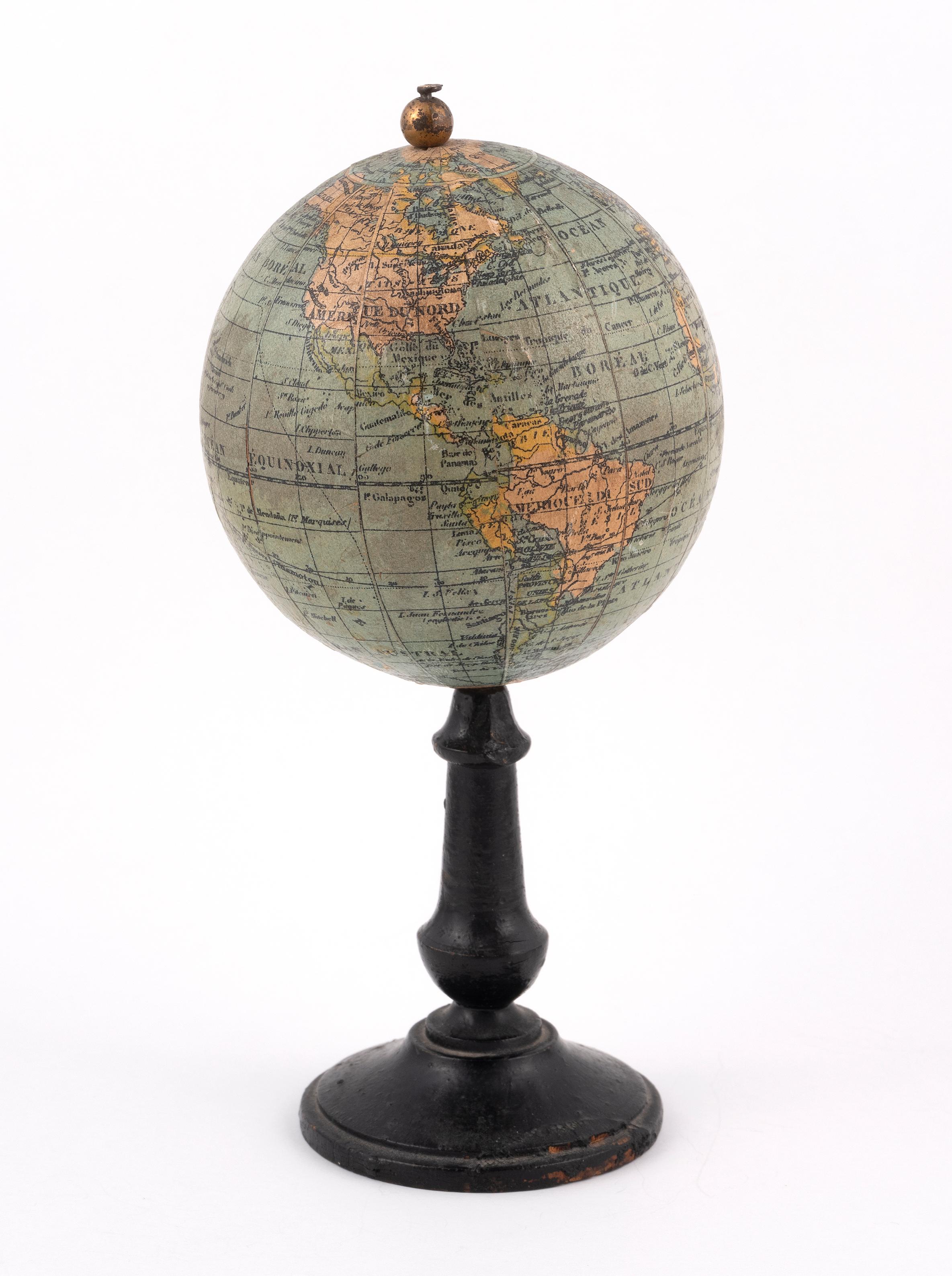 SHIPPING POLICY:
No additional costs will be added to this order.
Shipping costs will be totally covered by the seller (customs duties included). 

An early 20th-Century 3-inch diameter French terrestrial desk globe,
by Thomas