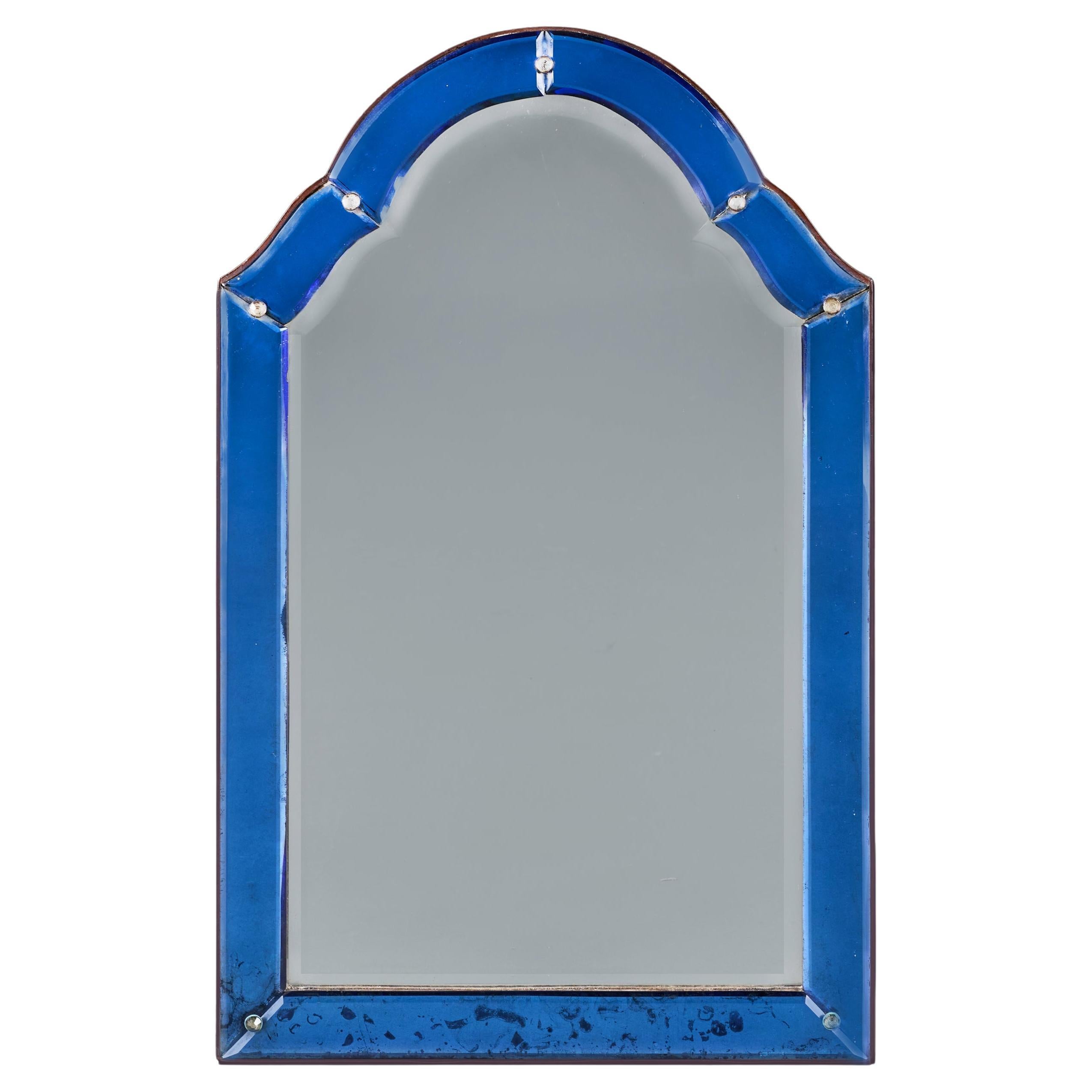 Miroir arqué en verre bleu Art Dec du début du 20e siècle.
