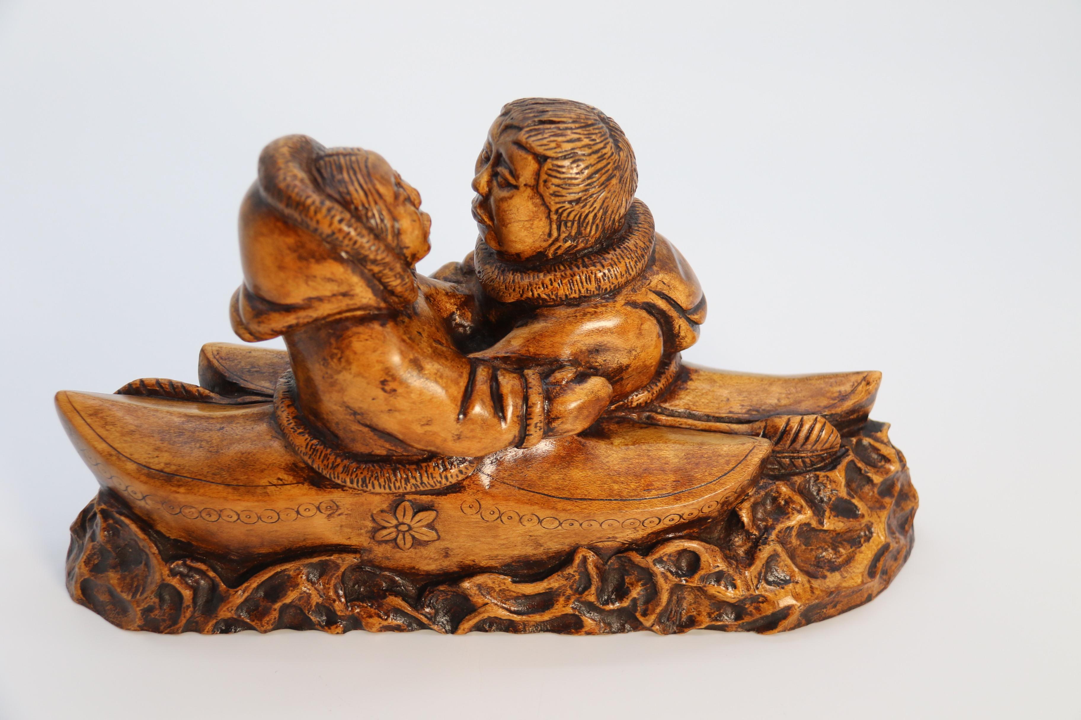 An early 20th century Canadian folk art maple wood carved Inuit figure group For Sale 4