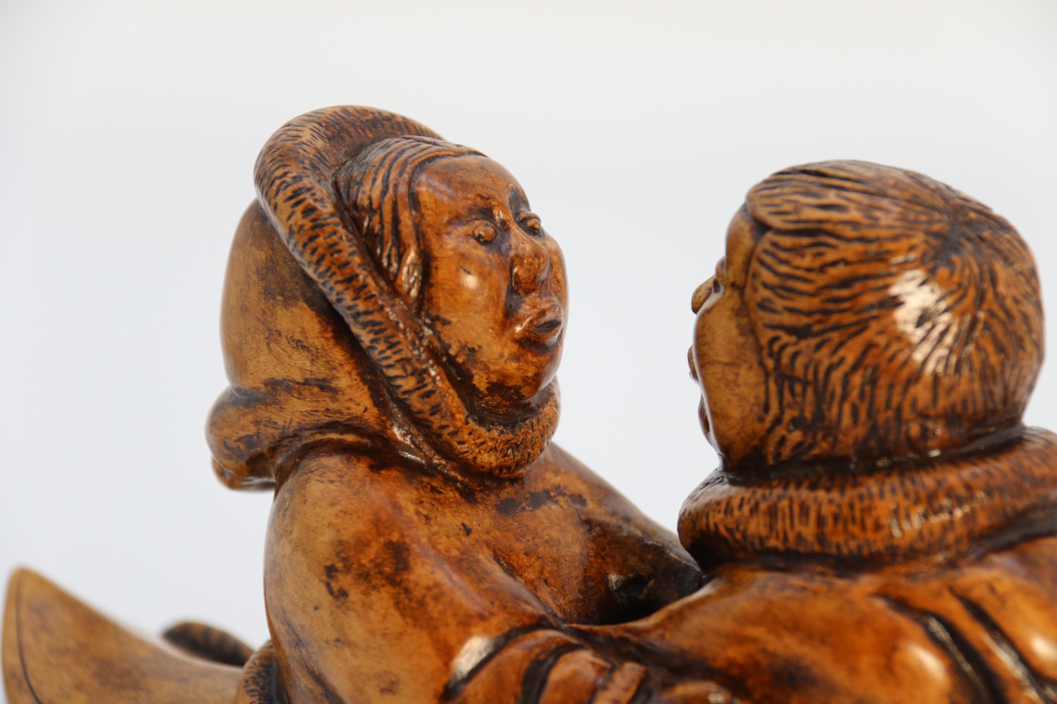 An early 20th century Canadian folk art maple wood carved Inuit figure group For Sale 5