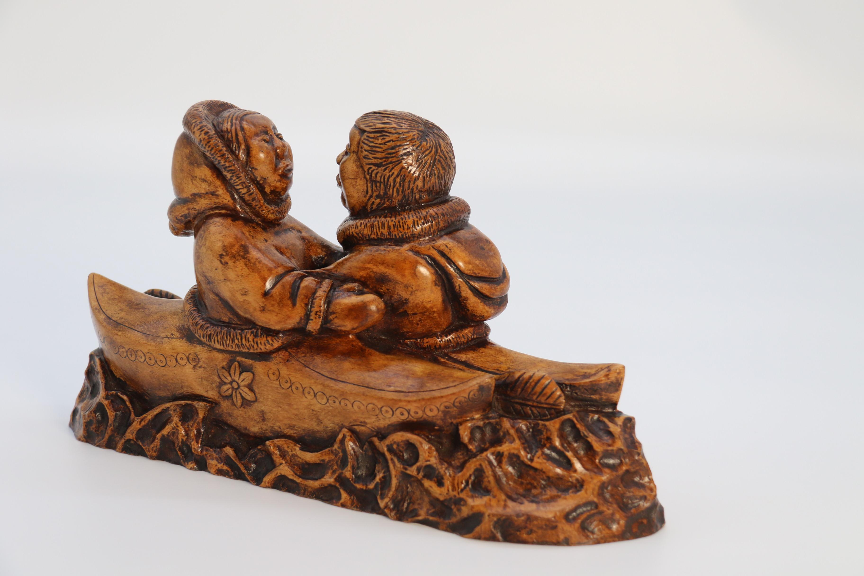 Folk Art An early 20th century Canadian folk art maple wood carved Inuit figure group For Sale