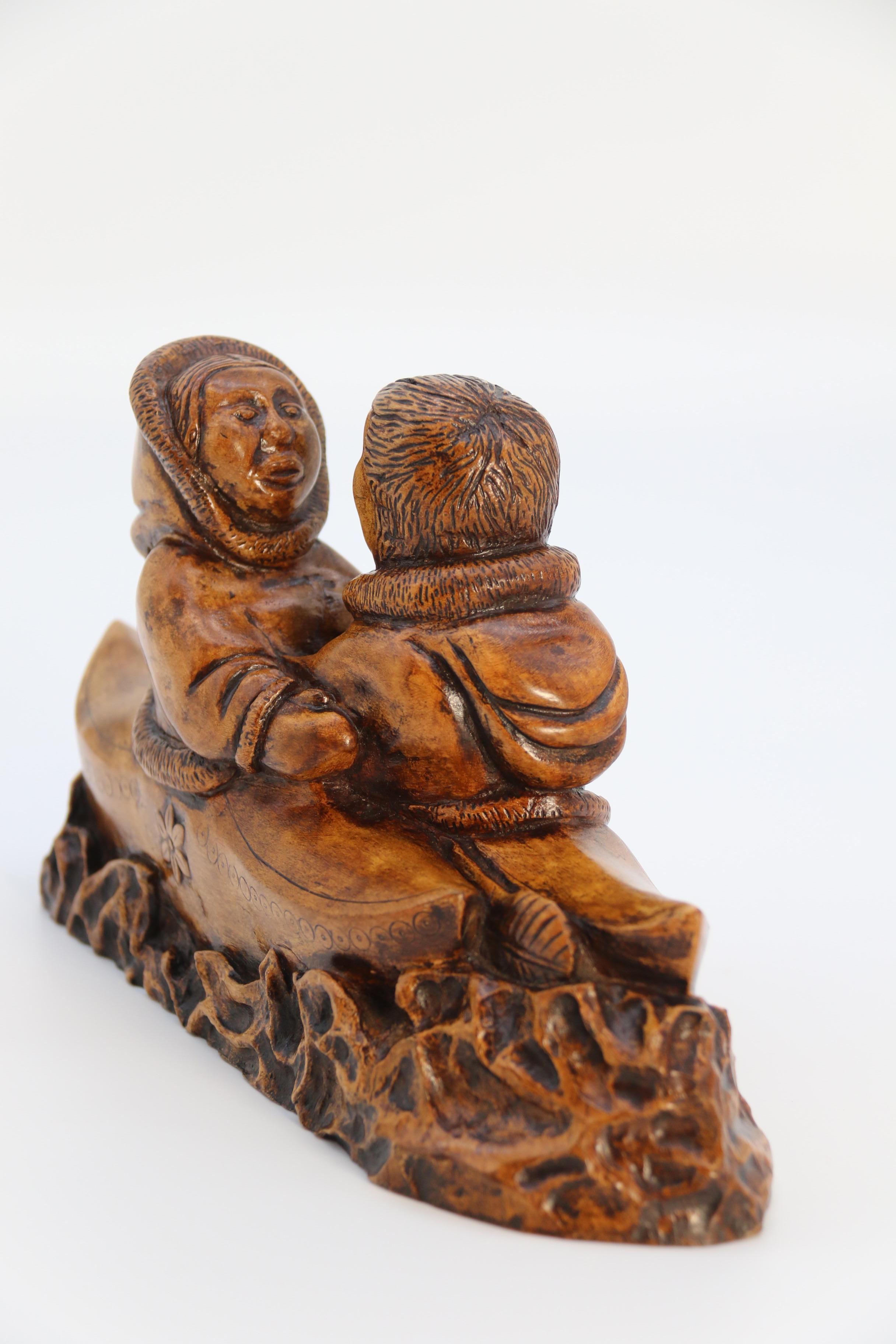Hand-Carved An early 20th century Canadian folk art maple wood carved Inuit figure group For Sale