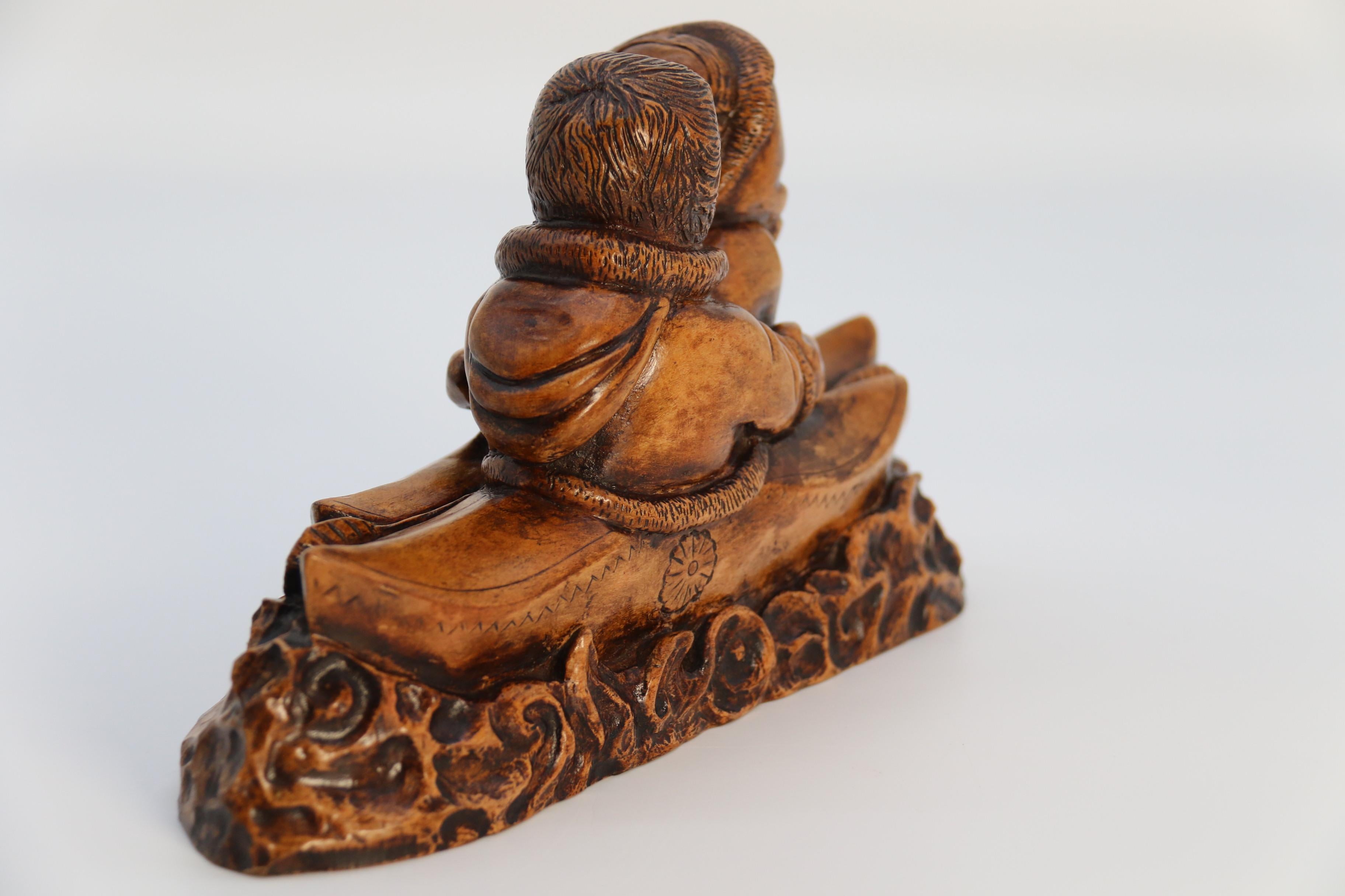 An early 20th century Canadian folk art maple wood carved Inuit figure group In Good Condition For Sale In Central England, GB