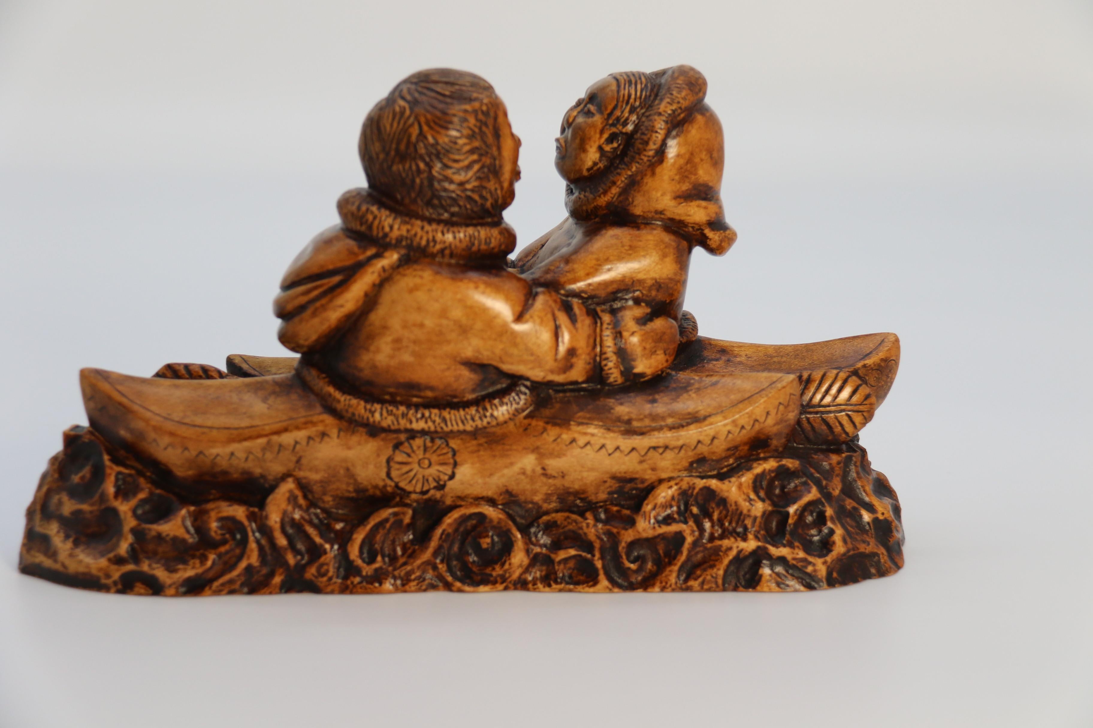20th Century An early 20th century Canadian folk art maple wood carved Inuit figure group For Sale