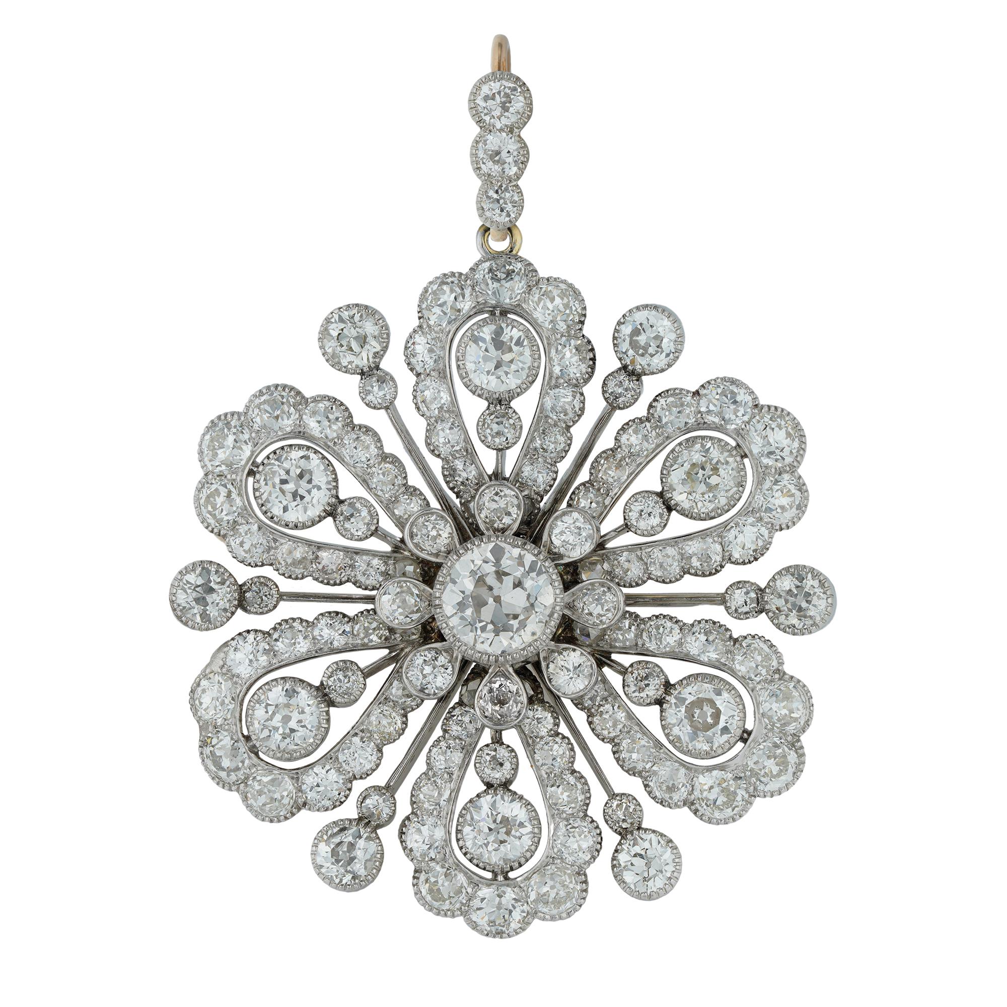 An early 20th century diamond centre and cultured pearl necklace, the detachable diamond-set centre of openwork flower cluster design, all set with old European-cut diamonds, estimated to weigh 11.5 carats in total, the central diamond estimated to