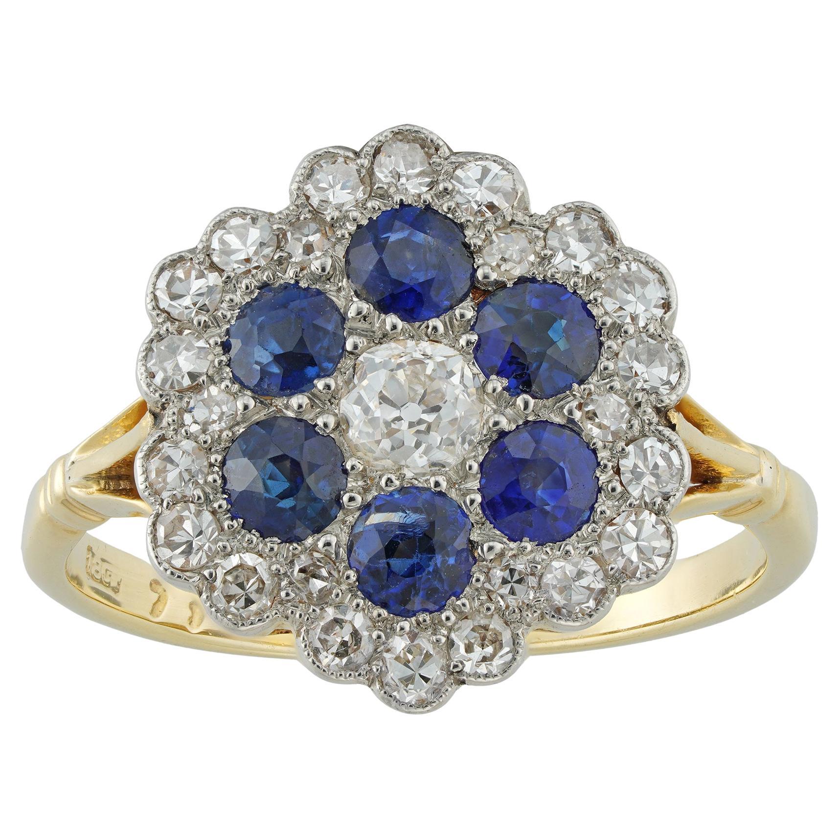 An early 20th century diamond and sapphire cluster ring For Sale
