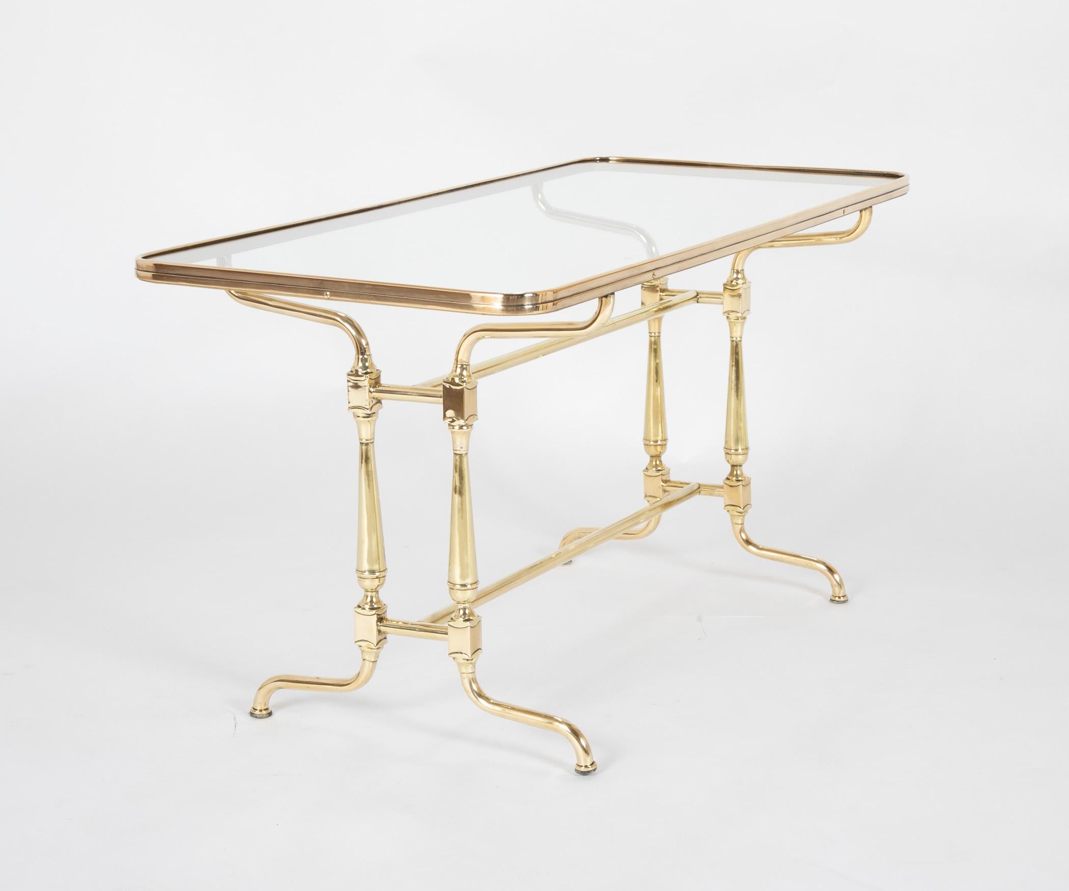 An early 20th century French glass top brass coffee table, circa 1910.