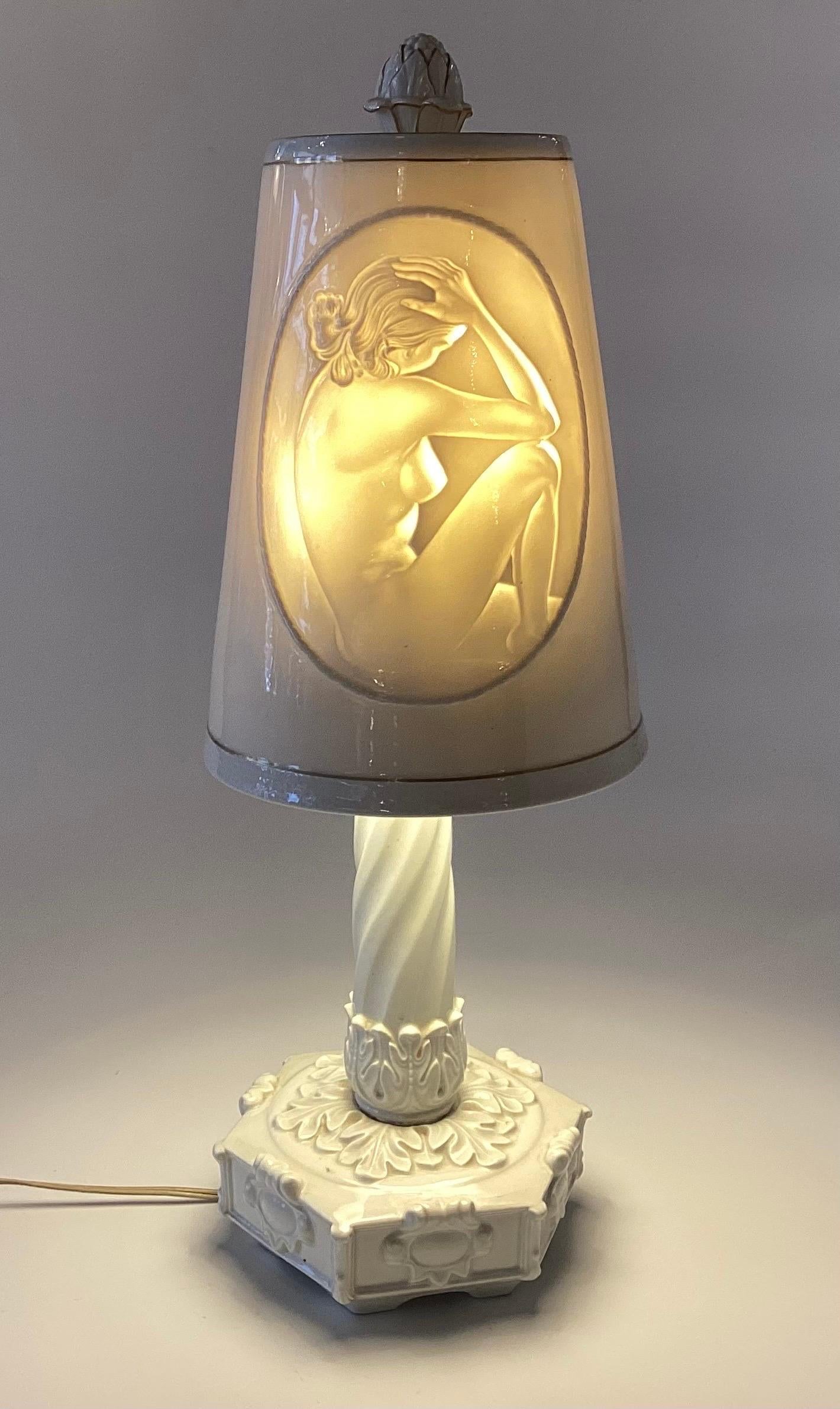 Elegant porcelain lithophane off white porcelain with a hidden figure of a female nude when turned on.