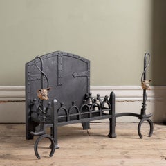 An Early 20th Century Iron and Bronze Fire Grate