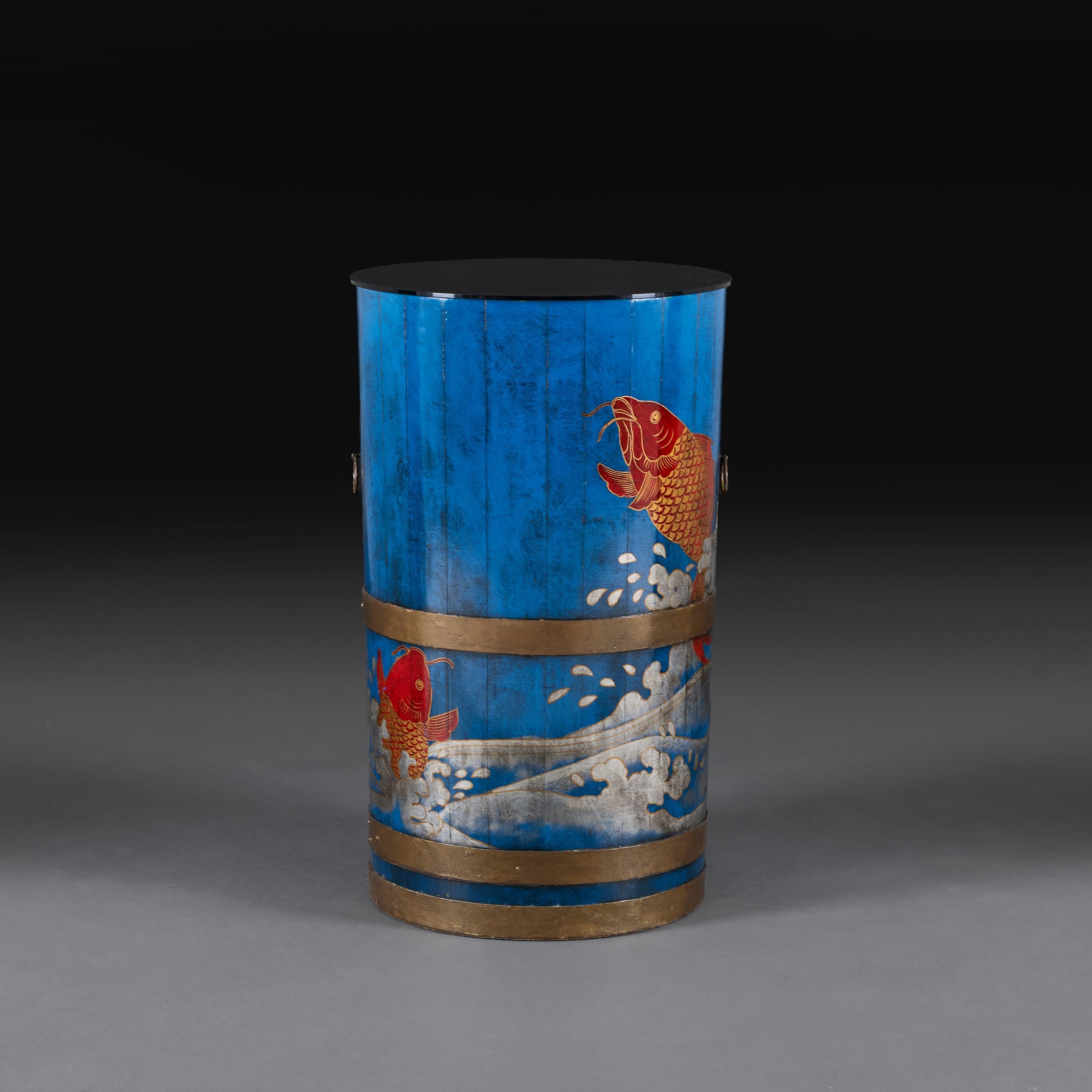 Japan, circa 1930

An unusual early twentieth century cylindrical jardiniere with leaping carp and breaking wave motif, with recess for a plant or glass top to use as a side table.

Height   72.00cm

Diameter   43.00cm.
