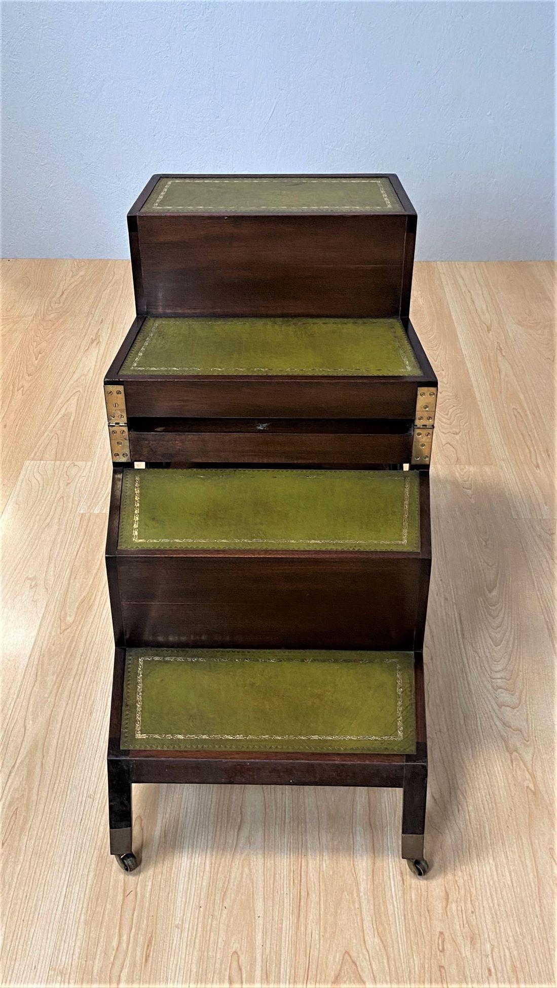 An early 20th century mahogany metamorphic library steps or chair in the Georgian.
The cane work seat with a green leather covered button swab, the whole raised on sabre legs.
This metamorphic chair changes into a solid set of steps with