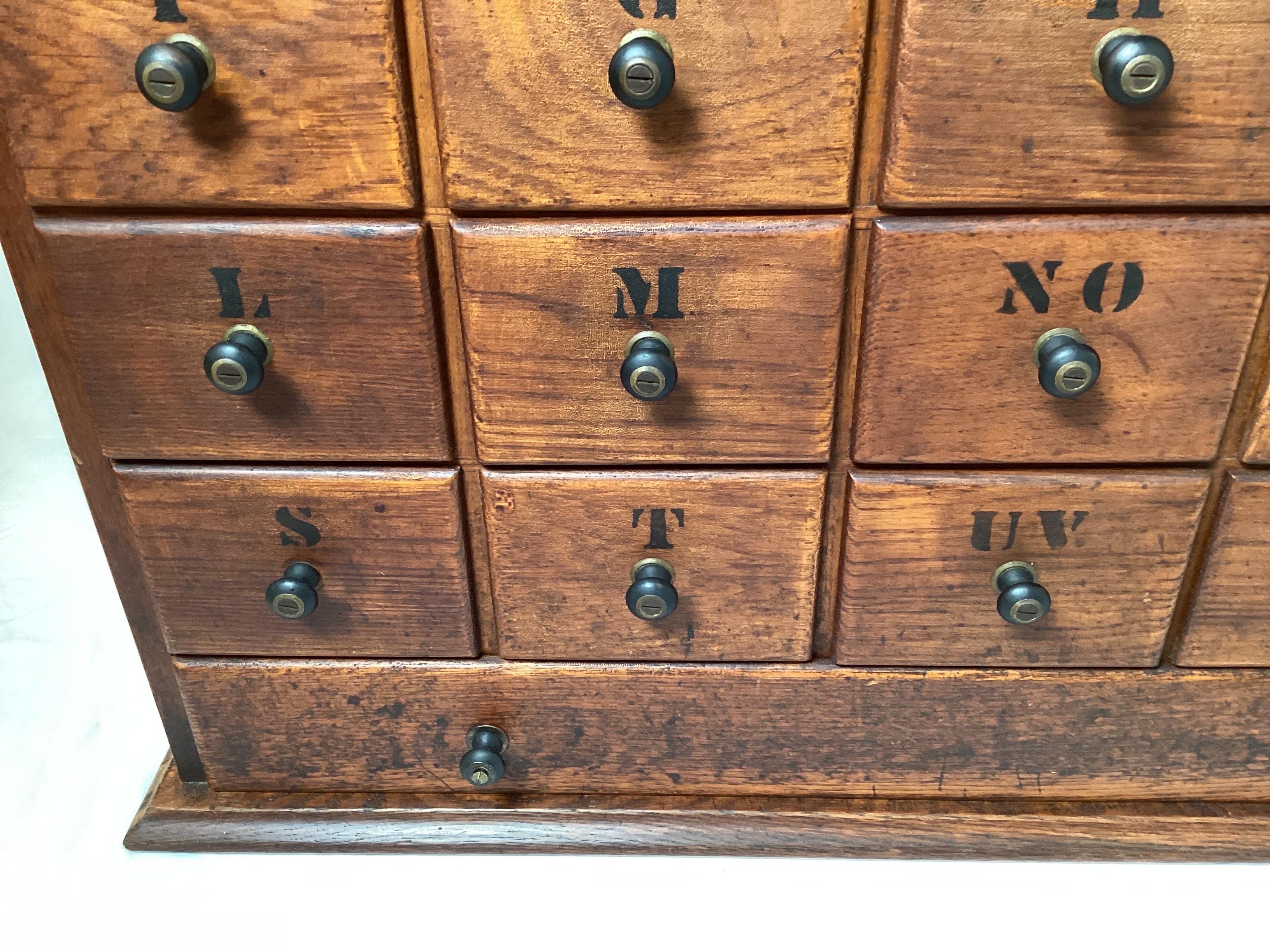 An Early 20th Century Oak Apothecary Cabinet 1