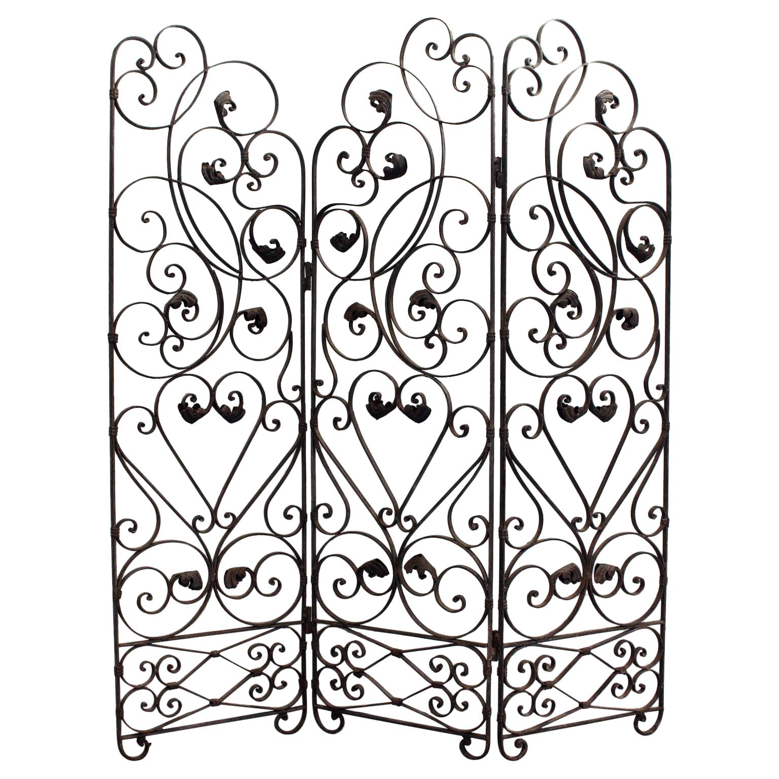 An Early 20th Century Ornate Wrought Iron Three Sided Screen