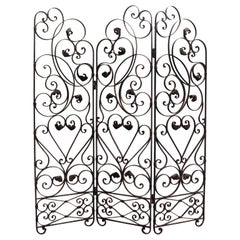 An Early 20th Century Ornate Wrought Iron Three Sided Screen