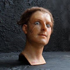 An early 20th century Paris wax mannequin head with glass eyes