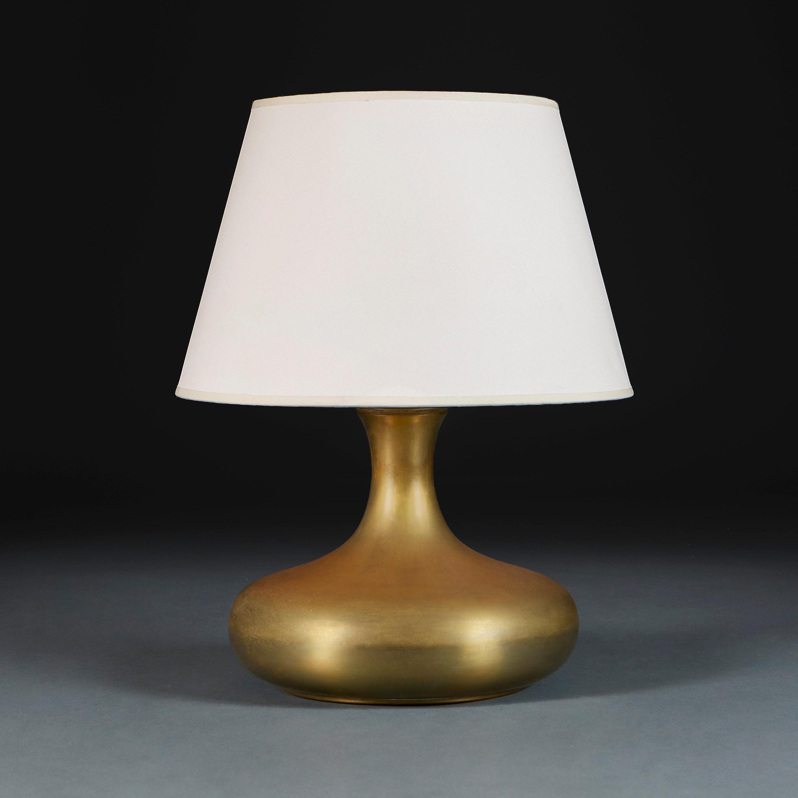 Denmark, circa 1930

An early 20th century Danish patinated brass vase of rotund form with flared neck, now converted as a lamp.

Height of vase 28.00cm
Height with shade 53.00cm
Diameter of body 33.00cm

Please note: This is currently wired for the