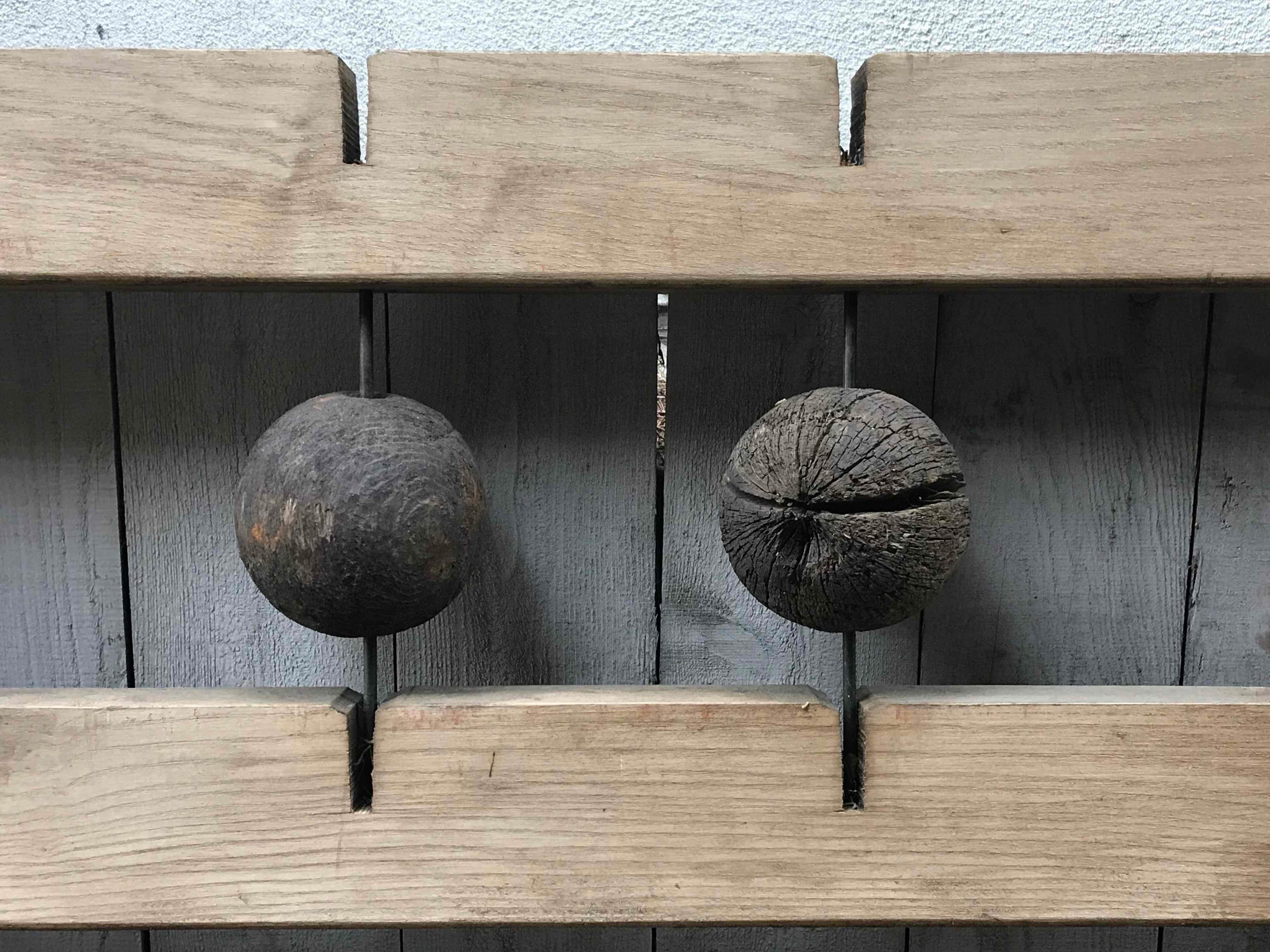 An industrial wooden panel with sculptural ball design. Originating from France, circa 1900. 