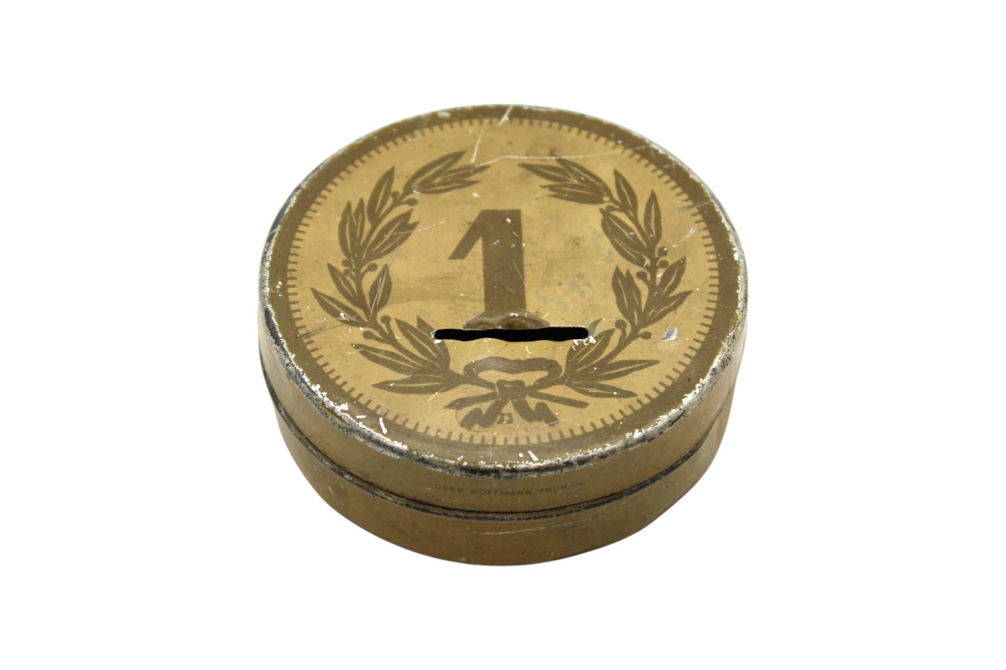 This unique vintage pushka (charity box) is a rare historical piece from an Agudath Israel convention held in early 20th-century Europe, possibly near Switzerland. The design and inscriptions suggest that it was distributed to attendees as a