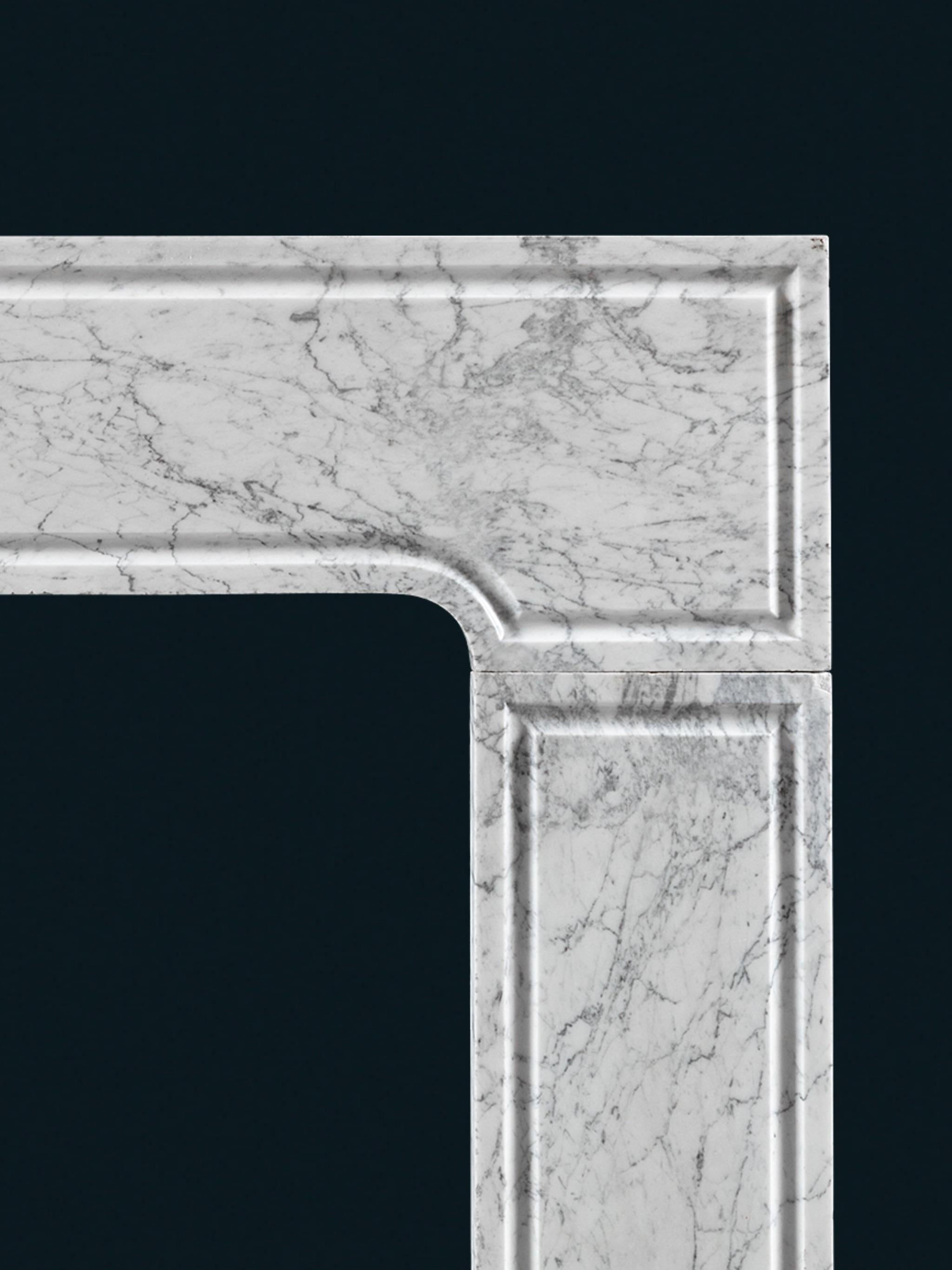 Carved An Early Eighteenth Century Carrara Marble Fireplace of Geometric Form For Sale