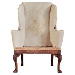 An Early Eighteenth Century Irish Walnut Wingback Armchair