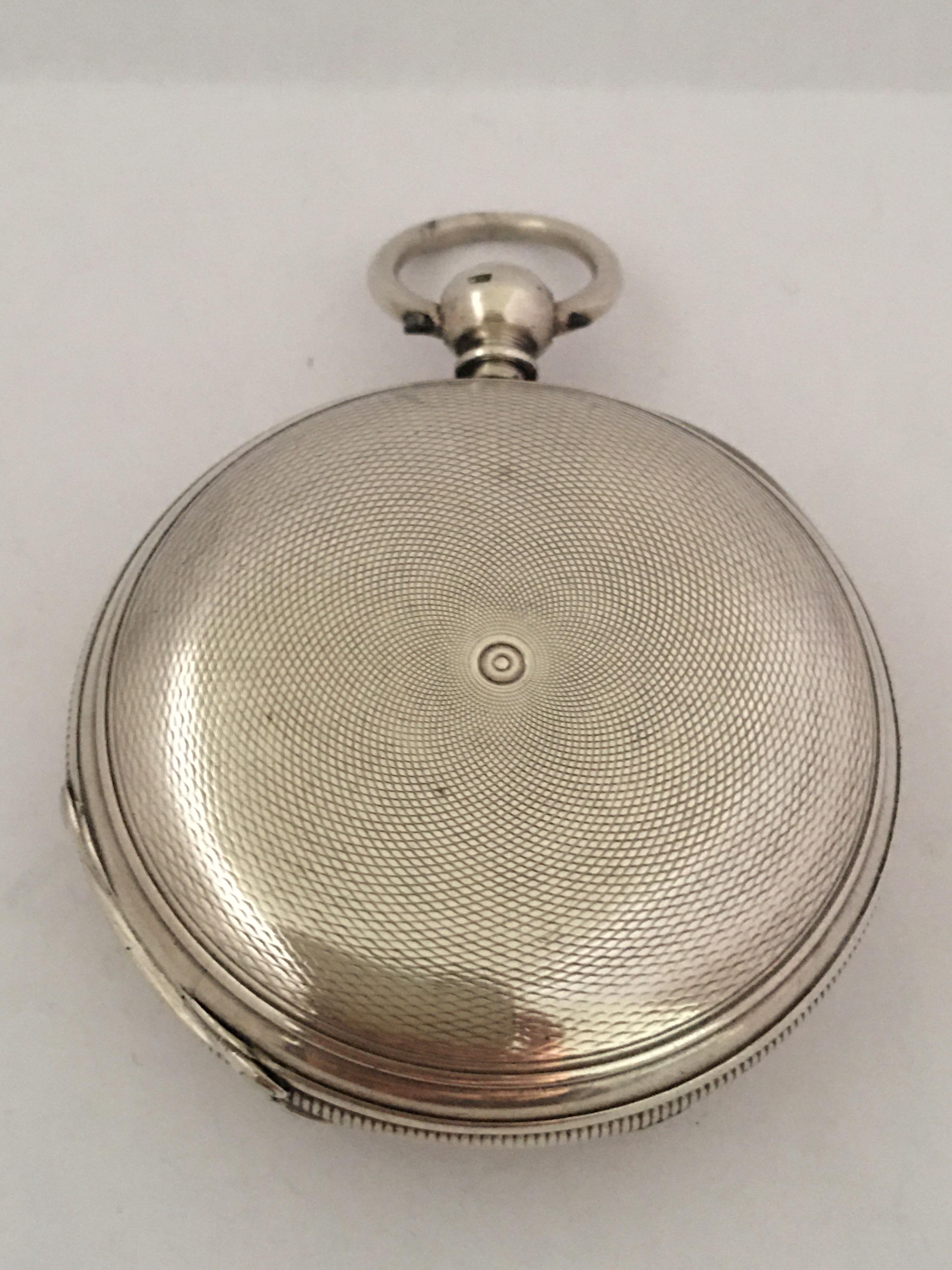 This Charming and good quality English Lever Fusee Silver Pocket watch is working and it is ticking well. It comes with a winding Key.

This watch shows a sign of aged and wearing, with its chipped and a hairline crack on the enamel dial as