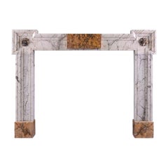 An Early Georgian Siena and Statuary Marble Fireplace