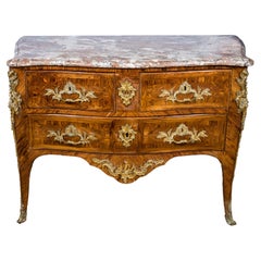 Commode en bois de roi, montée sur bronze doré, du début de la période Louis XV, par Nicolas Jean Marchand