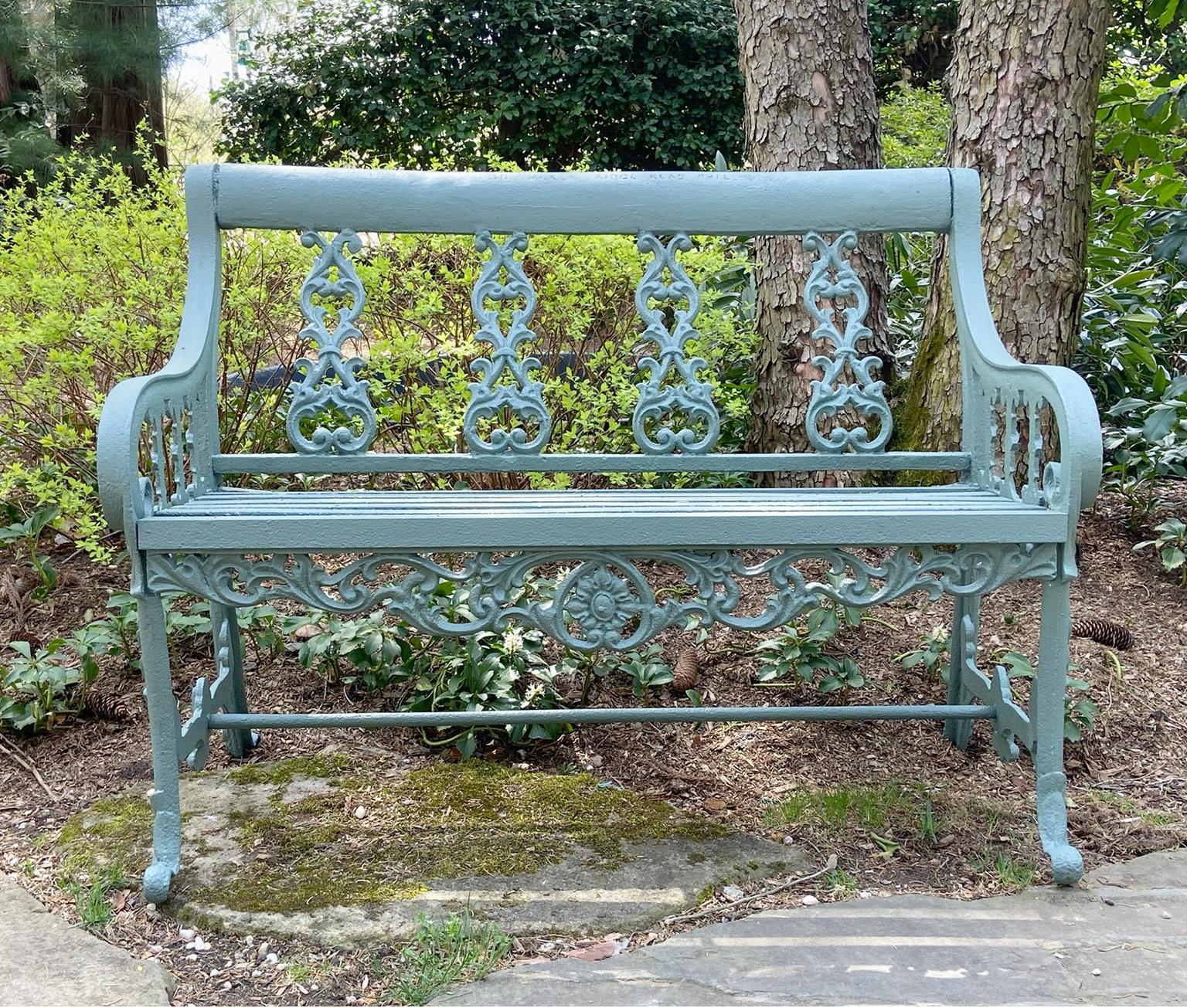 An early, rare cast-iron settee by Robert Wood of Philadelphia, marked “....Maker Ridge Road Phila”, the back with four leafy scrollwork splats, the crest rail of simple straight form, the gently sloped arms supported by scrolled complimentary