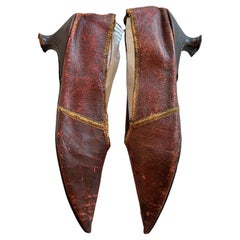 An early pair of burgundy leather shoes Circa 1790-1800