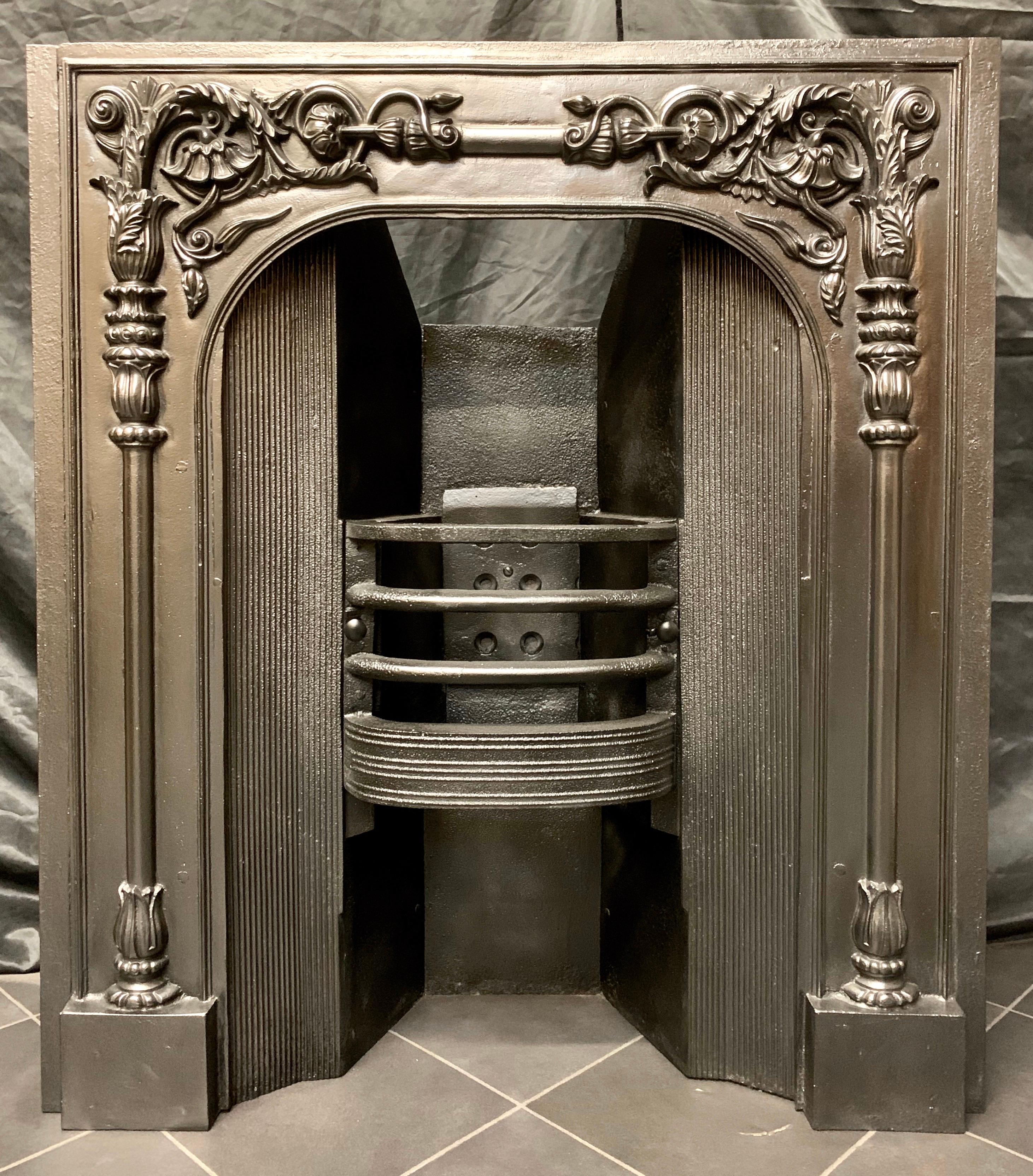 A rare early Victorian 19th century cast iron fireplace insert, with an integral fire grate, enhanced throughout with floral foliate detail. A set of slate slips could be supplied to increase the overall dimensions.
Scottish, circa 1840.
