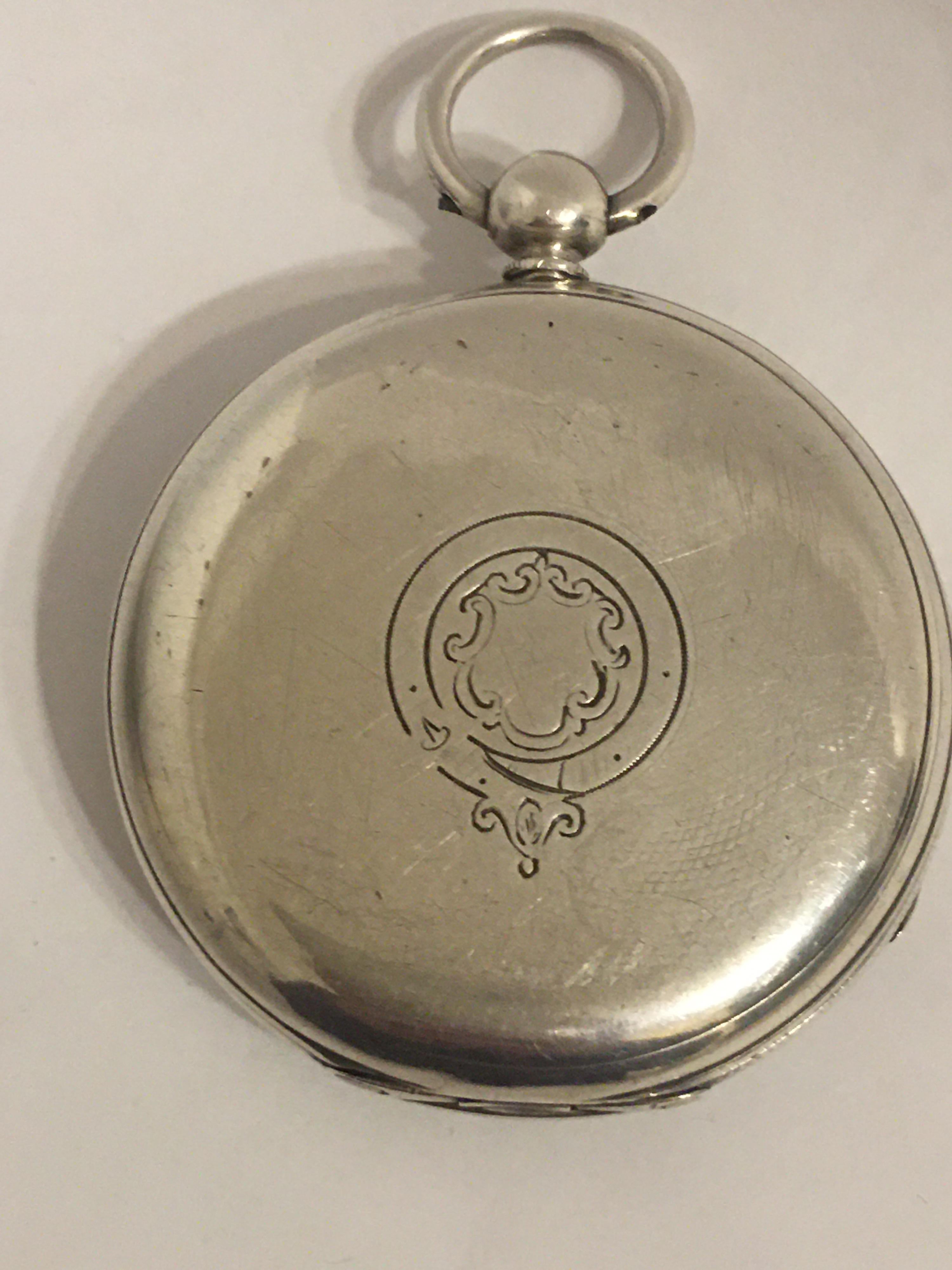 This beautiful silver pocket watch is in good working condition and is running well.