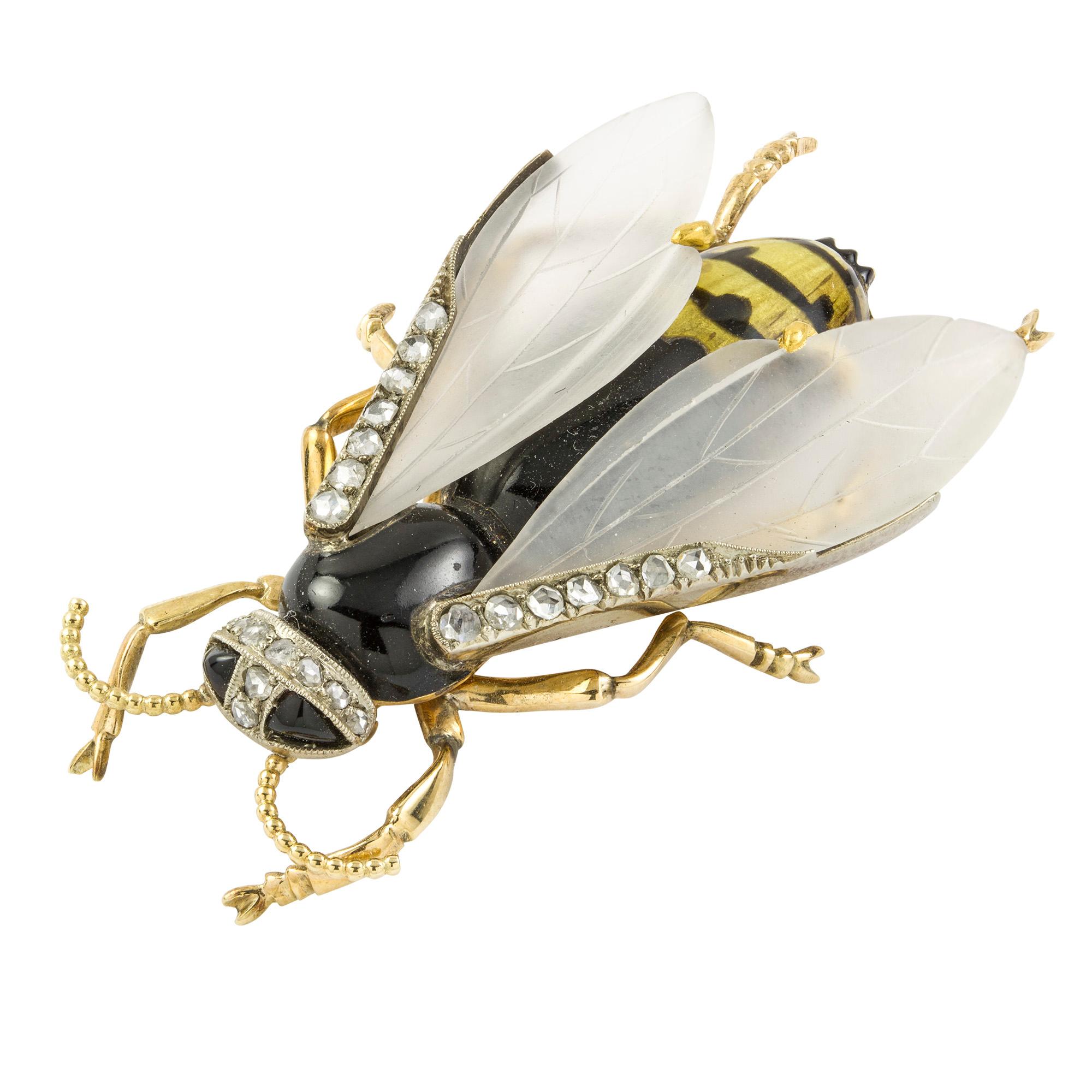 An early twentieth century diamond, enamel and crystal wasp brooch, the black and yellow enamel body with rose-cut diamond-set head, the frosted rock crystal wings with carved veins and rose-cut diamond details, all set in yellow gold and platinum,