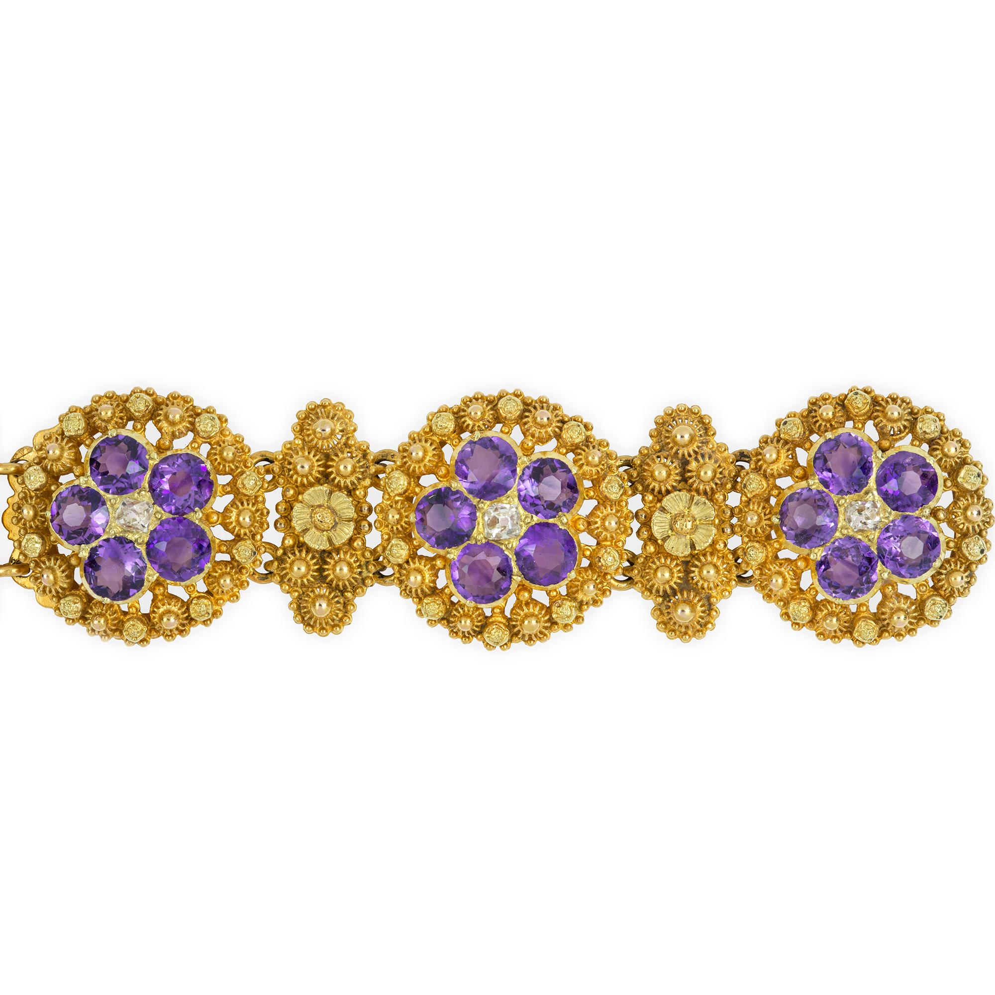 An early Victorian amethyst and diamond bracelet, composed of three flowerhead each set with old cut diamond at the centre and round faceted amethyst petals surrounded by fine filigree decoration, alternating with similar design lozenge shape links,