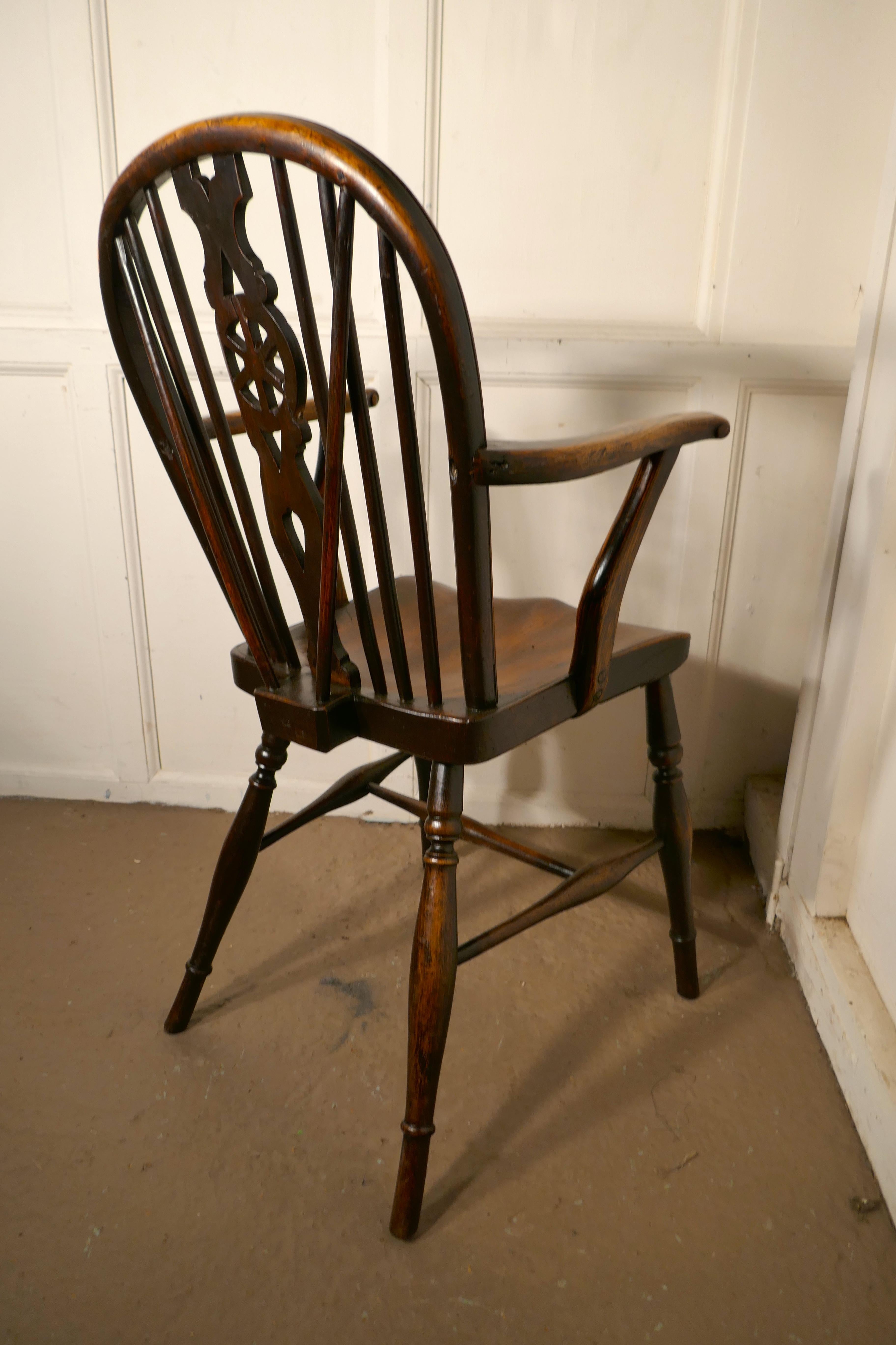 Mid-19th Century Early Victorian Beech and Elm Wheel Back Carver Chair