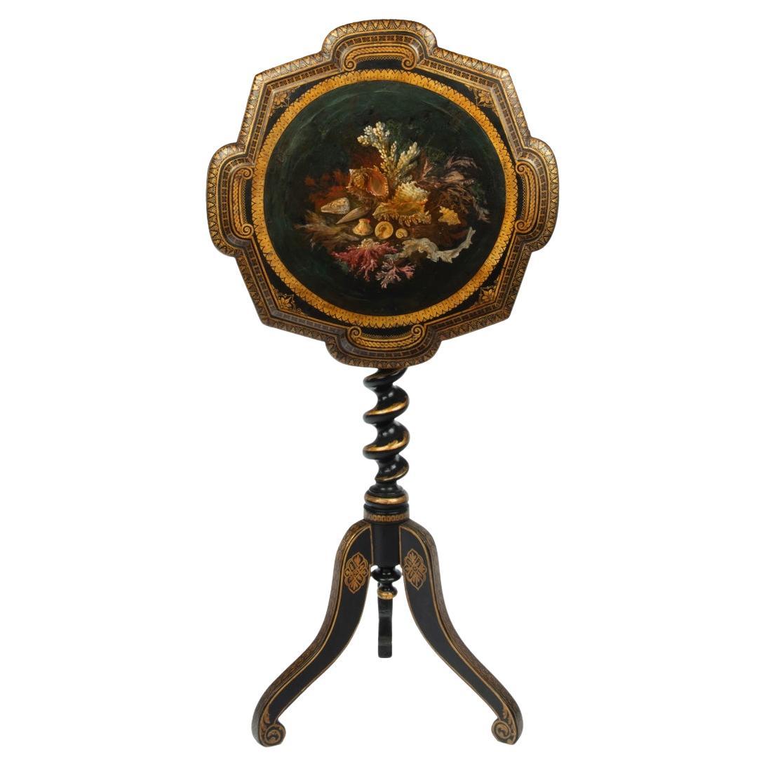 An early Victorian black and gilt papier-mâché occasional table For Sale
