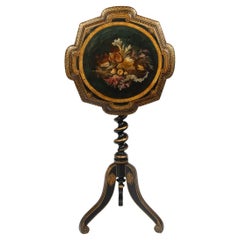 An early Victorian black and gilt papier-mâché occasional table