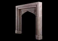 An Early Victorian Carved Stone Fireplace In The Gothic Style