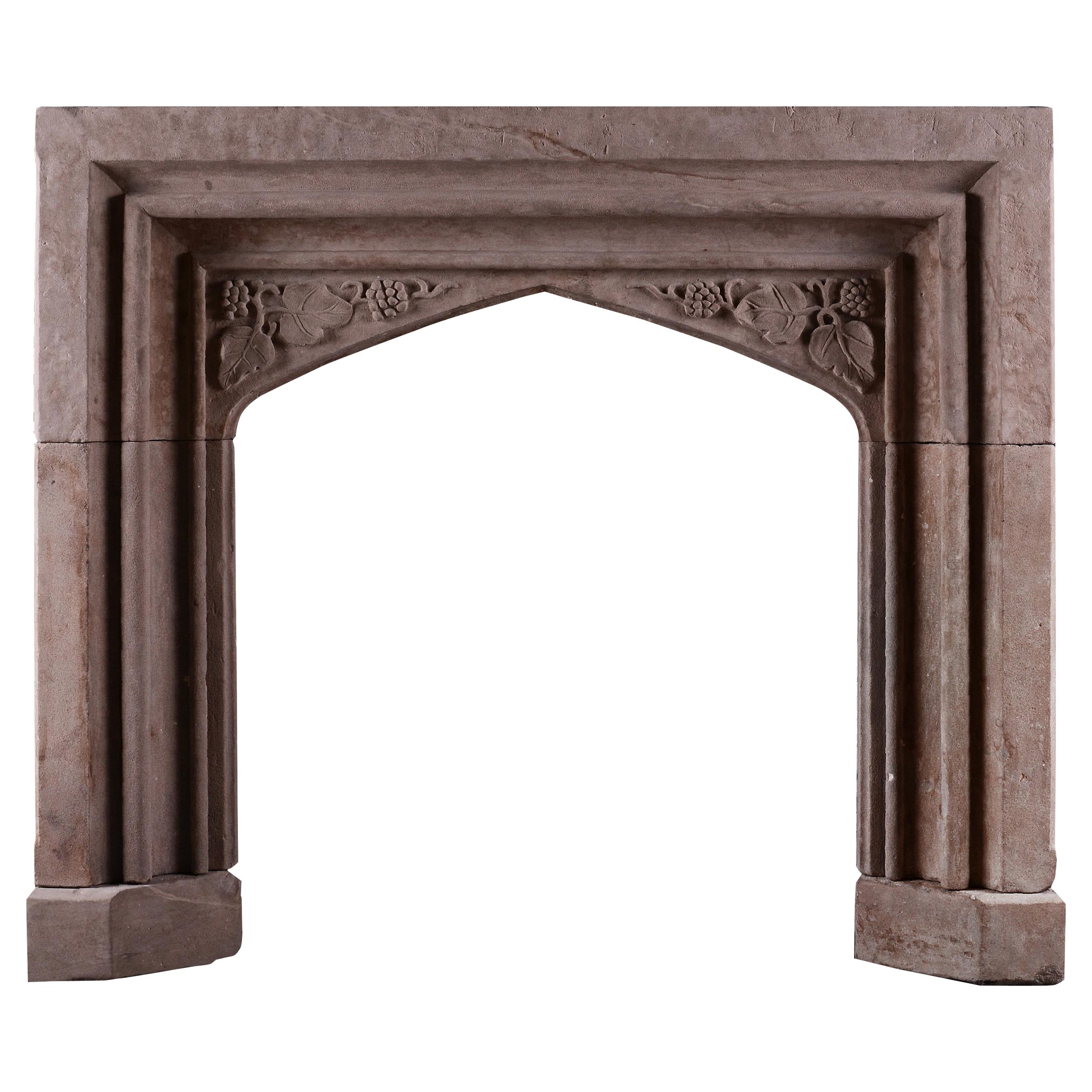 An Early Victorian Carved Stone Fireplace In The Gothic Style For Sale