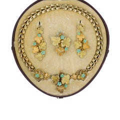 An Early Victorian Gold Turquoise Floral Suite