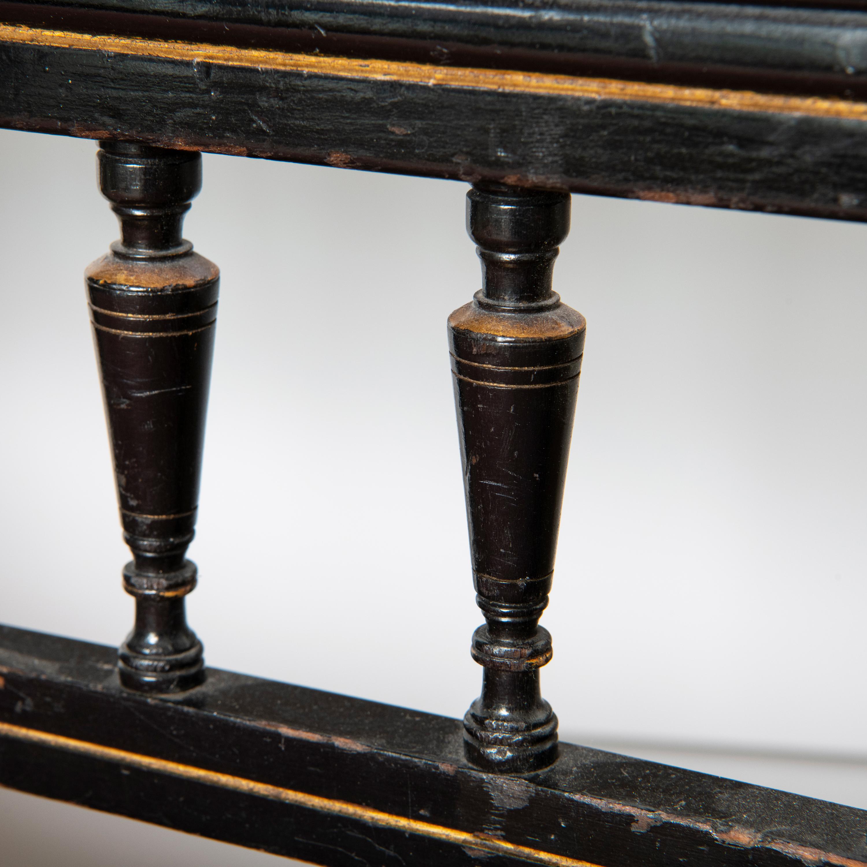 Aesthetic Movement An Ebonised and Walnut Settee by Lamb of Manchester, England circa 1880