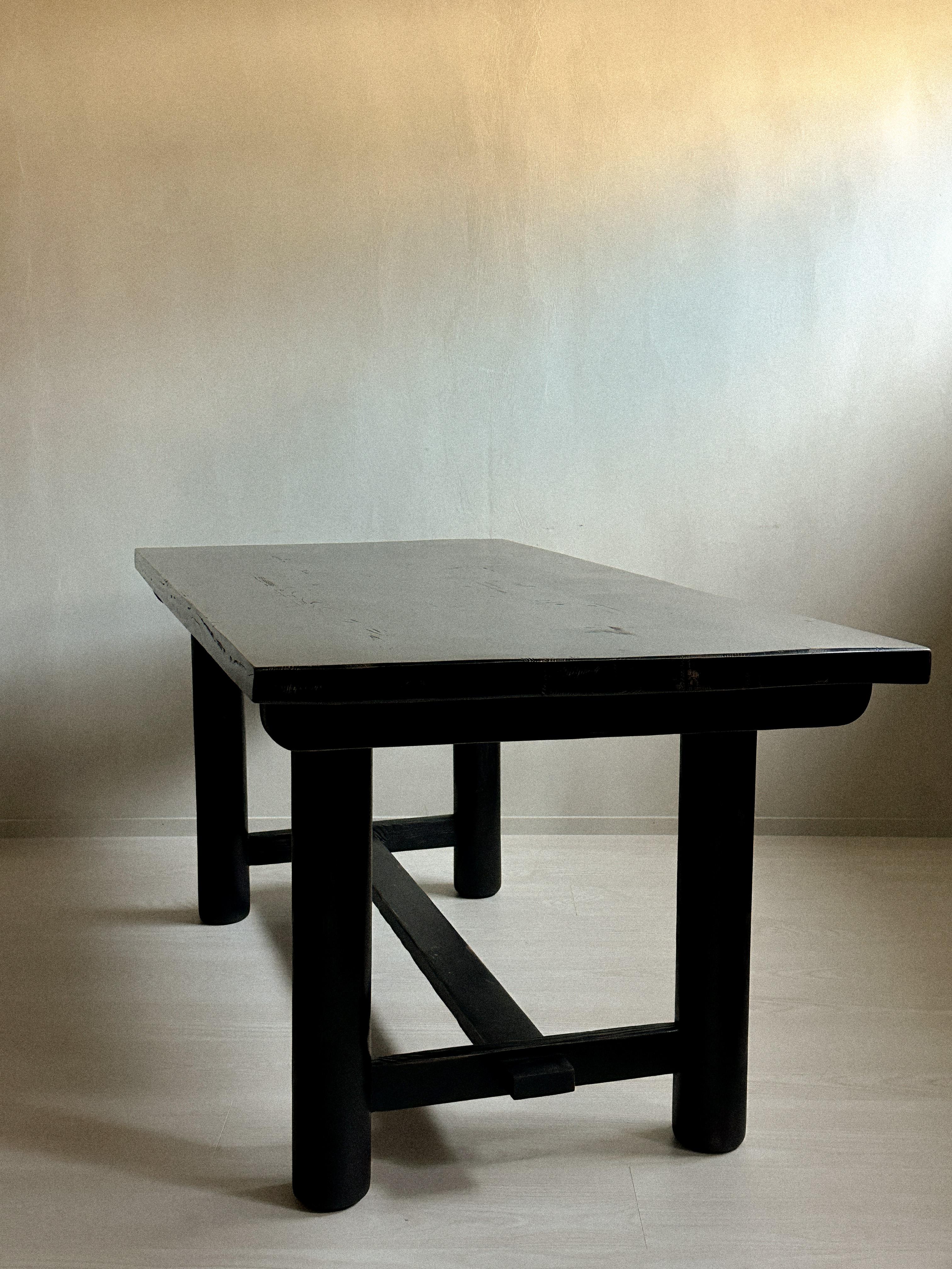 A beautiful and massive ebonzied dining table or desk from a family holiday-house built in 1959 in Les Allues, Meribel. Assumingly designed by Charlotte Perriand. Original dark stained pinewood with a wonderful patina. 

Wear consistent with age and
