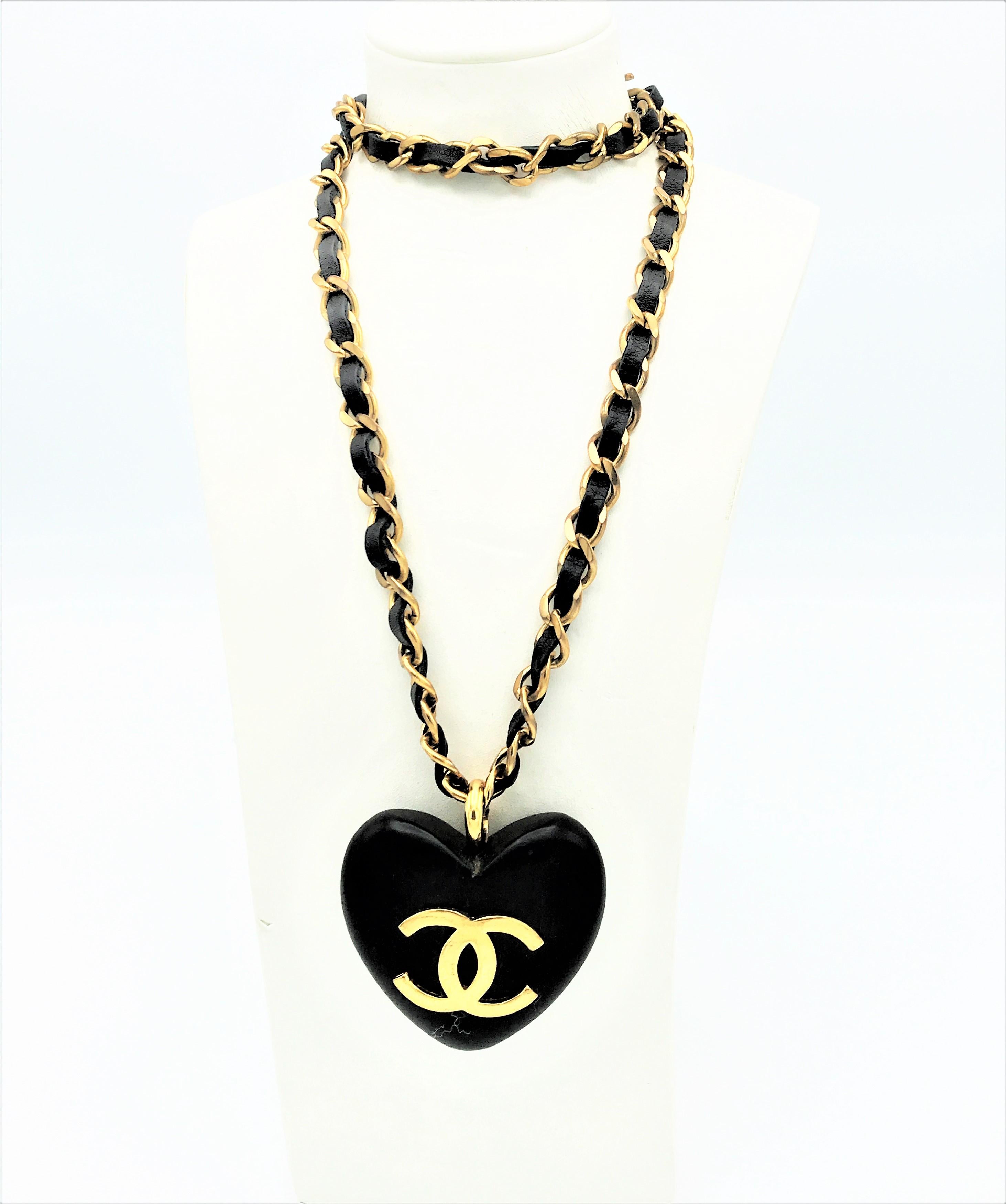 Modern An Ebony Heart hangs on the iconic Chanel chain with leather sign. 1990