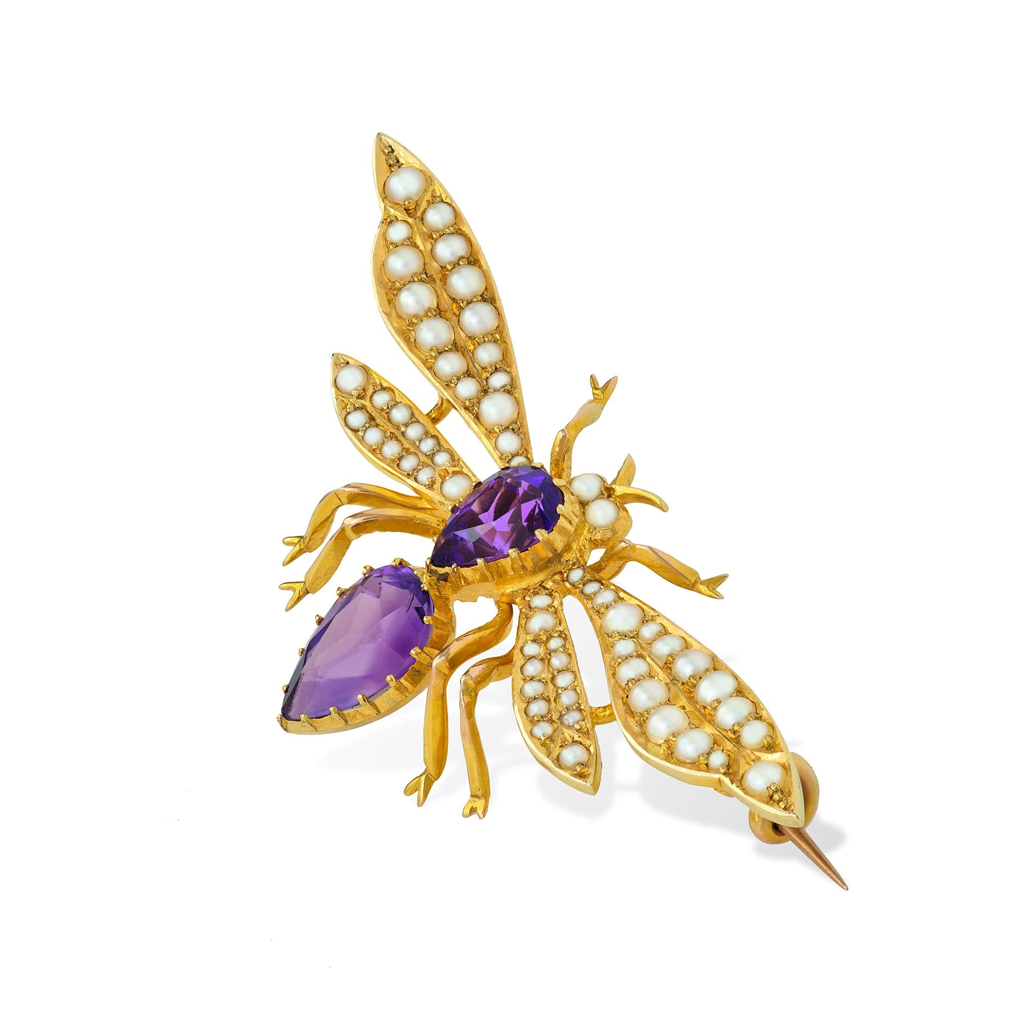 An Edwardian amethyst and pearl dragonfly brooch, with faceted amethyst-set thorax and abdomen and seed pearl set wings, the eyes set with pearls, all to a yellow gold mount, circa 1900, measuring 2.5x5.4cm, gross weight 7.5 grams.

This antique