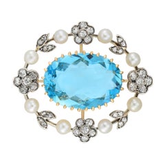 An Edwardian aquamarine, diamond and pearl pendant