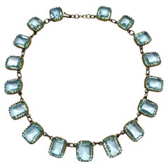 An Edwardian aquamarine faceted glass riviere necklace, French, c1900.