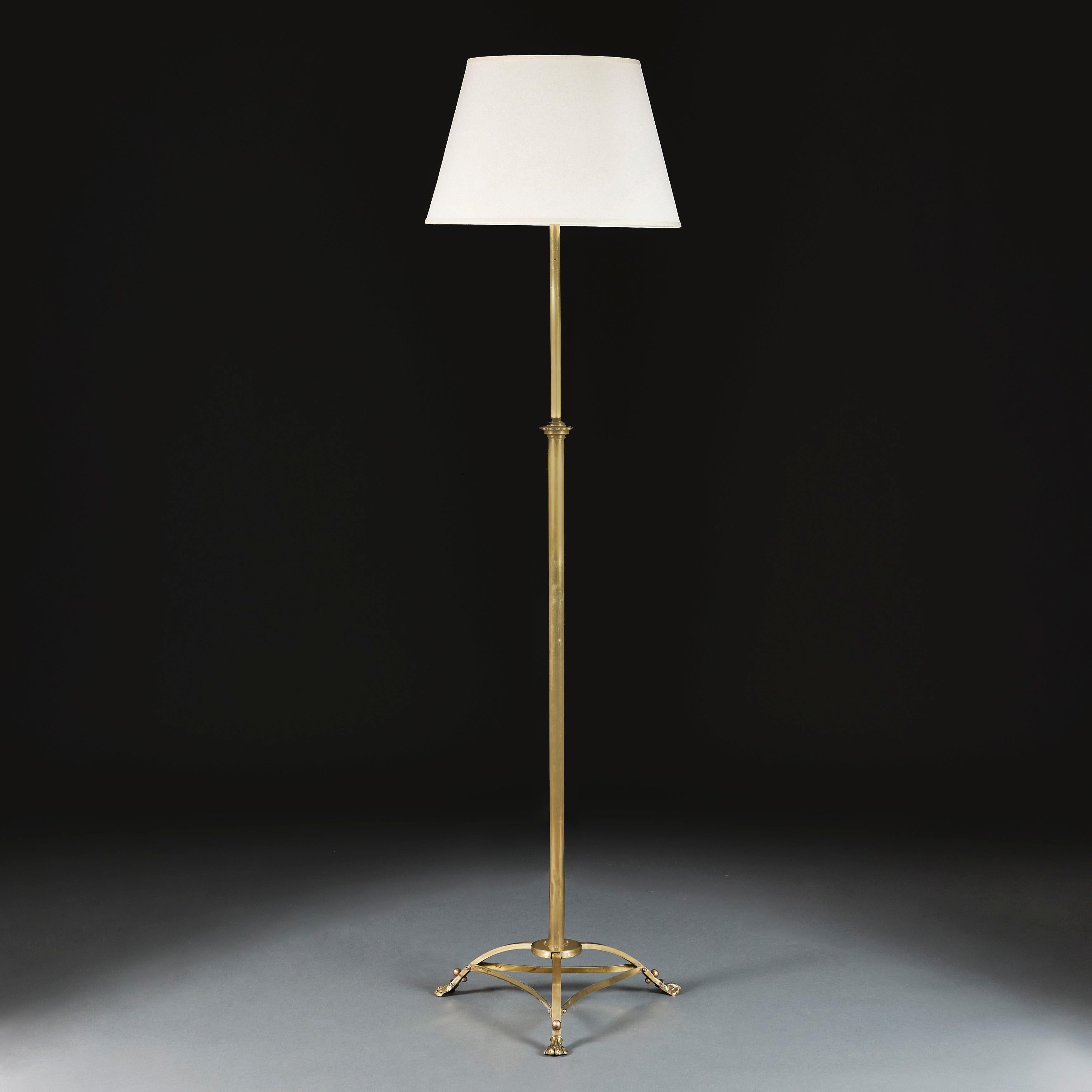 England, circa 1900

An Edwardian brass floor lamp with adjustable stem, supported on a tripod base with brass stretchers and hairy paw feet.

Height 148.00cm
Height with shade 180.00cm
Width of base 46.00cm.

Please note: This is currently wired