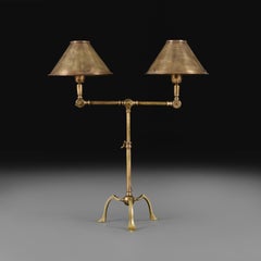 An Edwardian Brass Twin Arm Articulated Desk Lamp